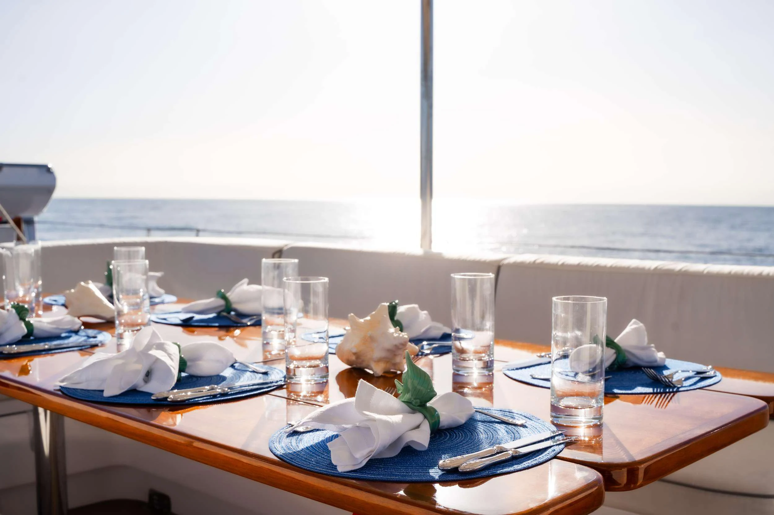 a table with food and glasses aboard VARSOVIE Yacht for Charter