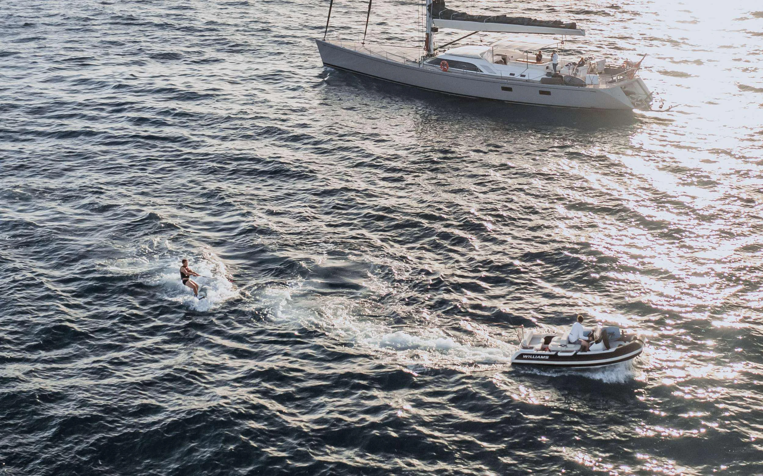 a boat is sailing in the sea aboard VARSOVIE Yacht for Charter