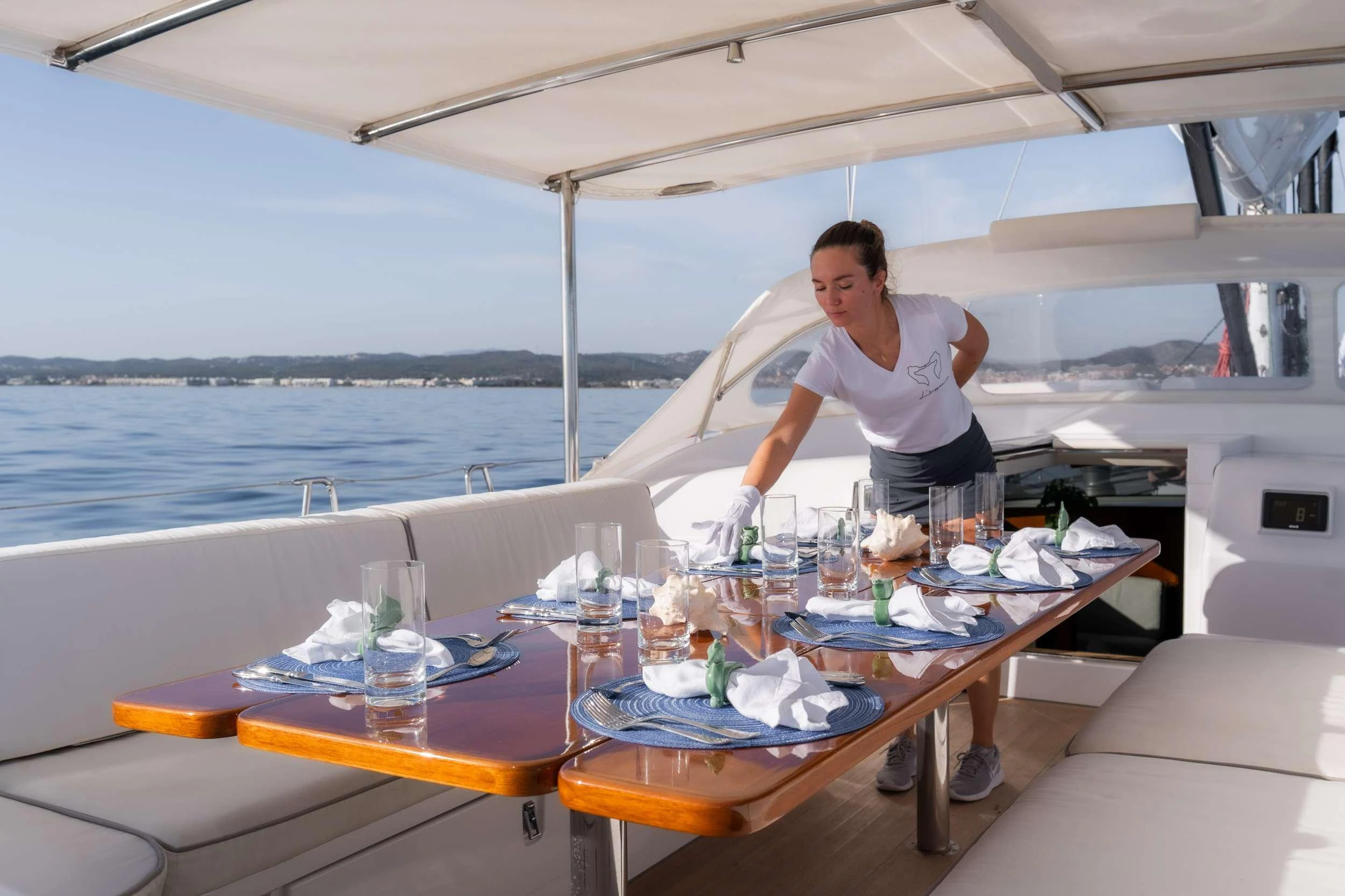 a man standing on a boat aboard VARSOVIE Yacht for Charter