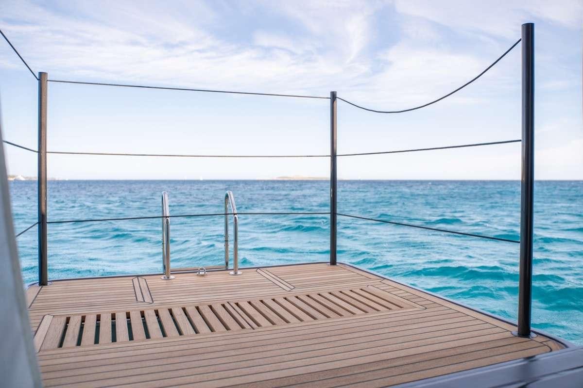 a wooden dock over the ocean aboard SEVENTY8 Yacht for Charter