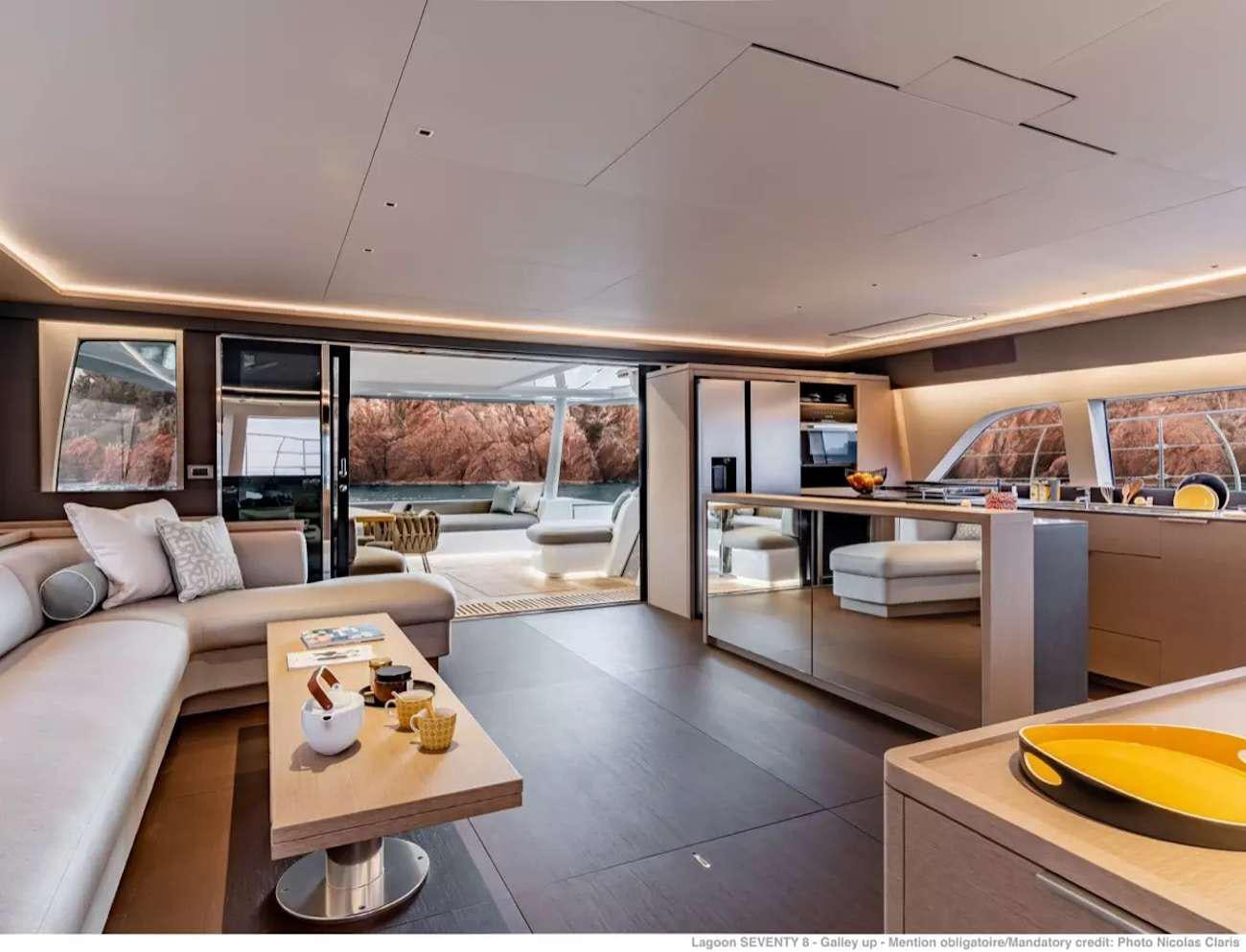 a living room with a large window aboard SEVENTY8 Yacht for Charter