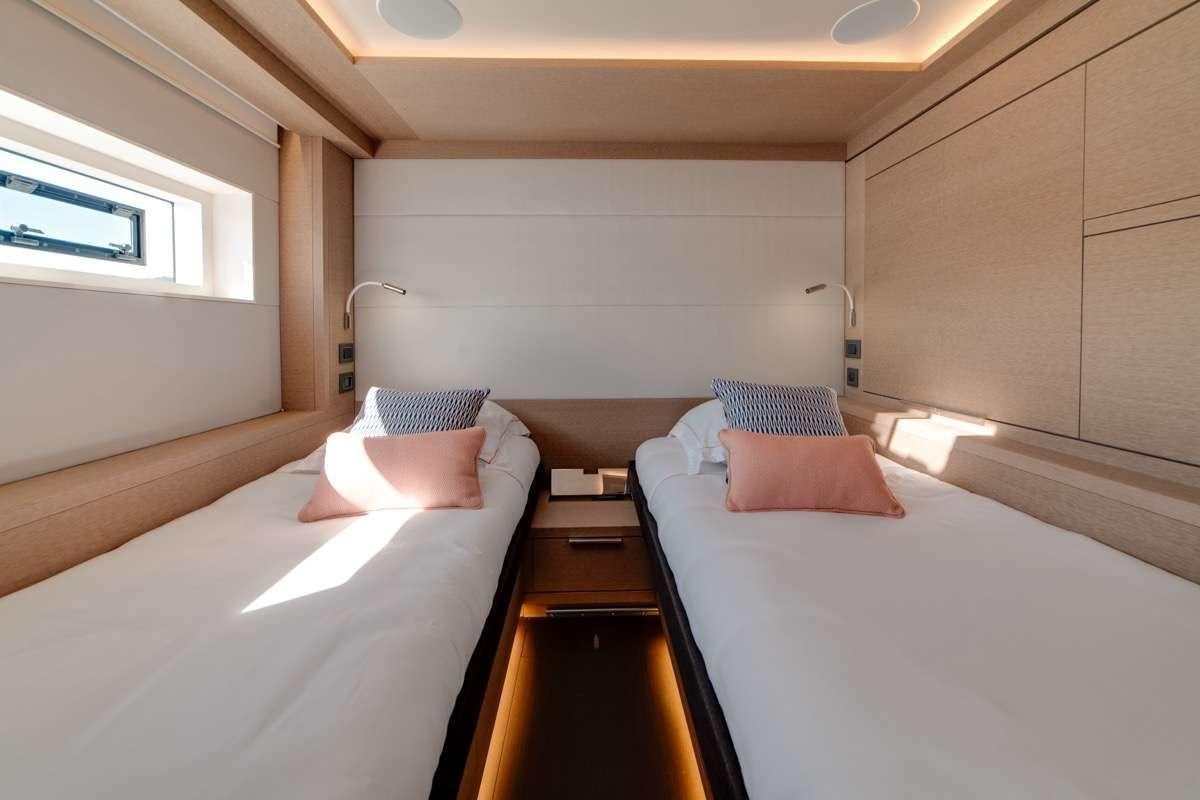 a room with two beds aboard SEVENTY8 Yacht for Charter
