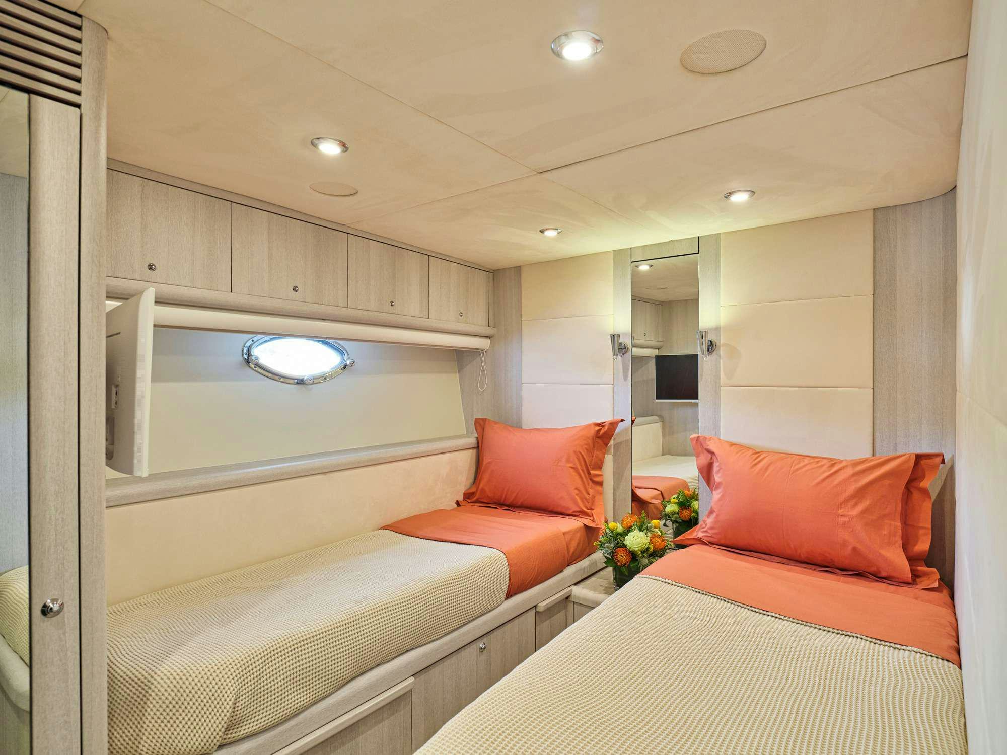 a room with a bed and a mirror aboard M FIVE Yacht for Charter