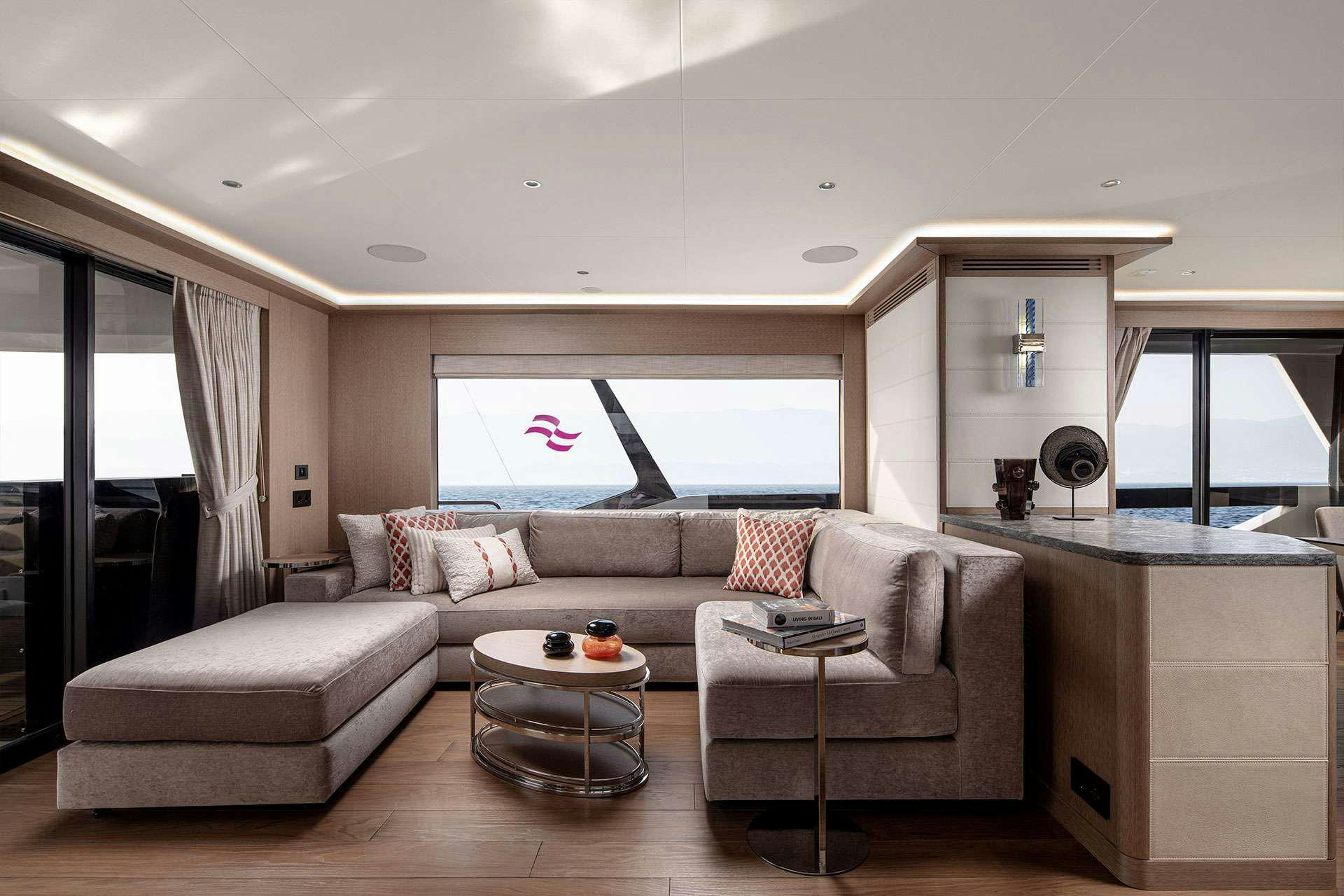 a living room with a couch and a table aboard SAINT Yacht for Charter