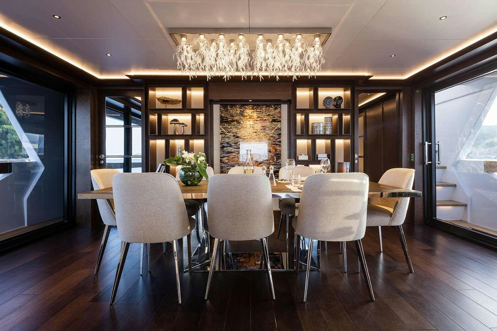 a large kitchen with a chandelier aboard SAINT Yacht for Charter