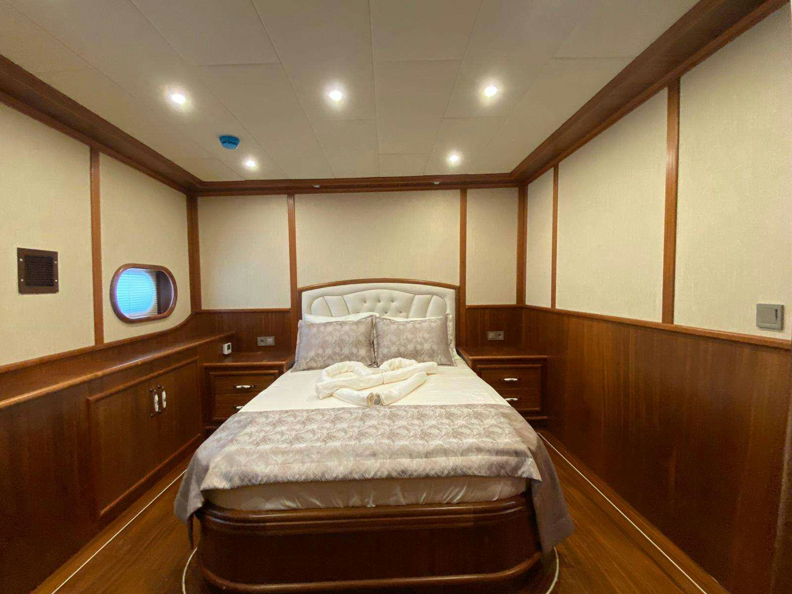 a bed in a room aboard LA MIA STELLA Yacht for Charter
