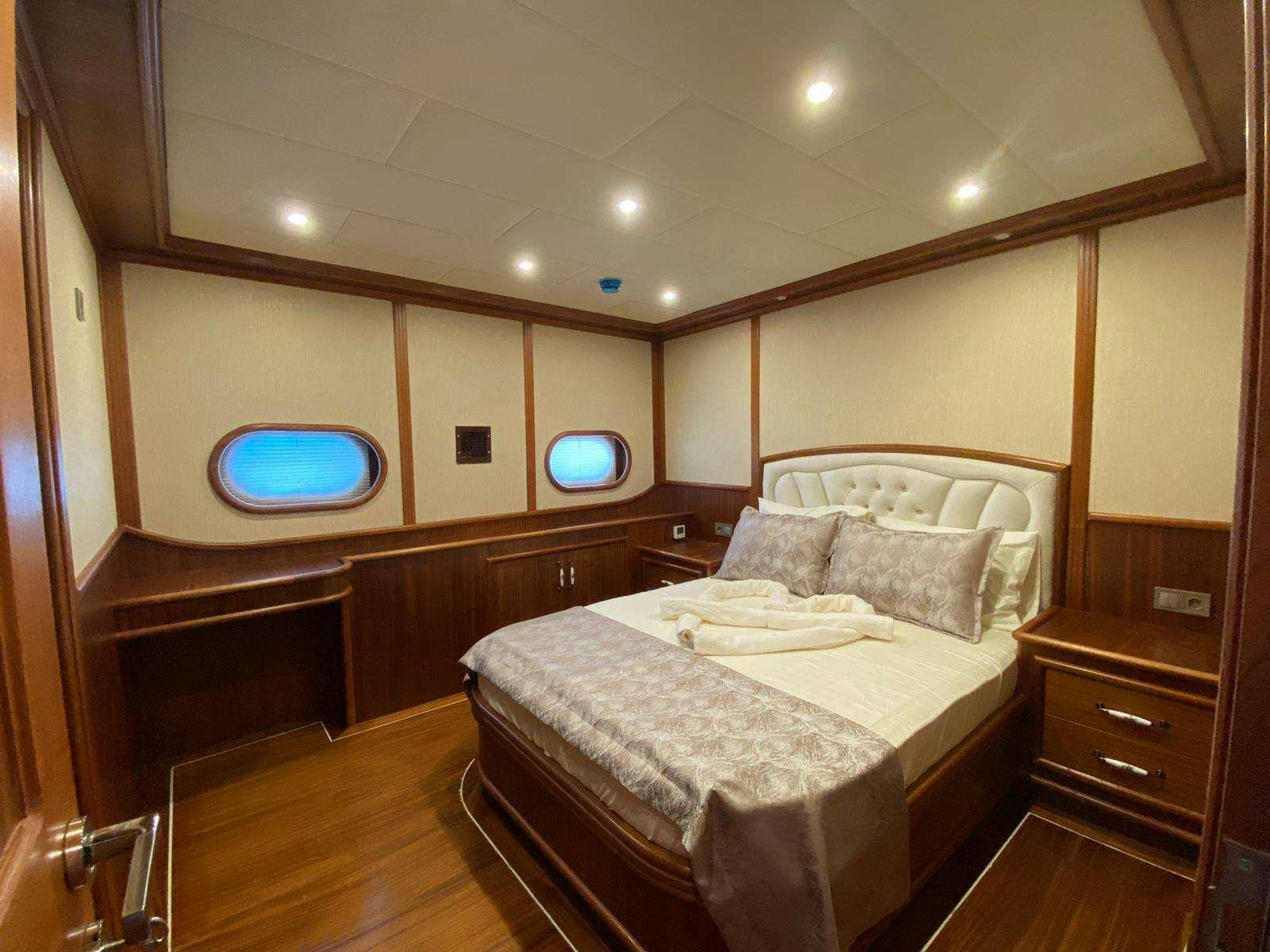 a bed in a room aboard LA MIA STELLA Yacht for Charter