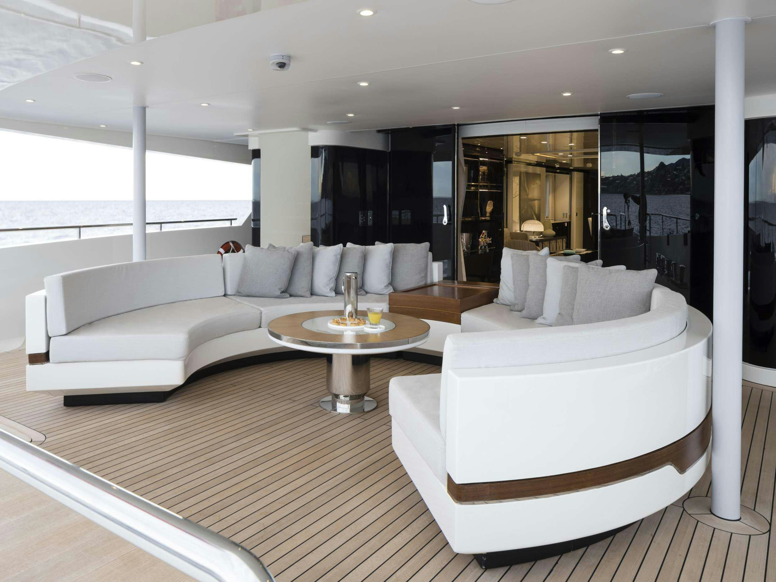 a living room with a large window aboard ANDIAMO Yacht for Charter