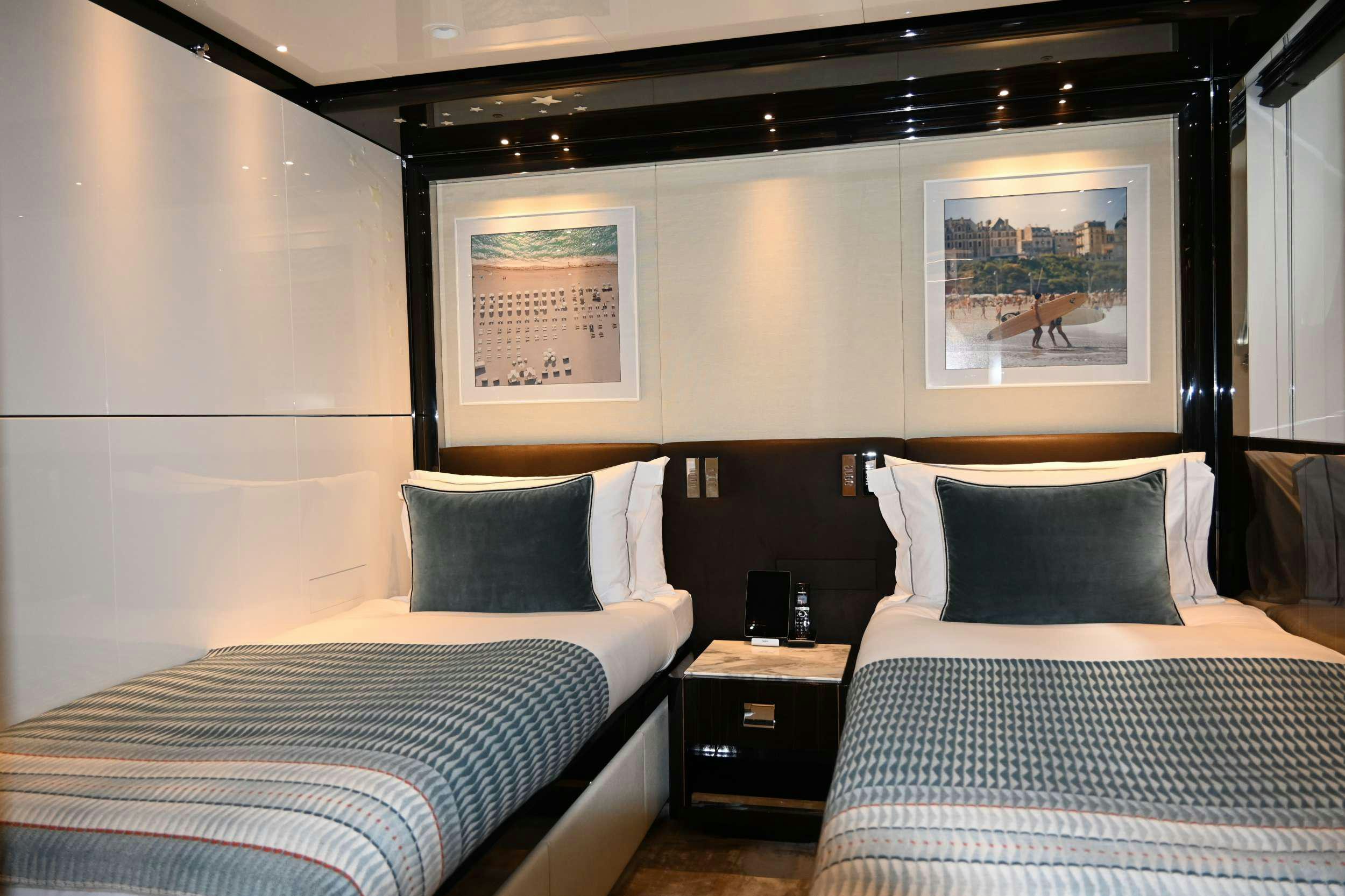 a couple of beds in a hotel room aboard ANDIAMO Yacht for Charter