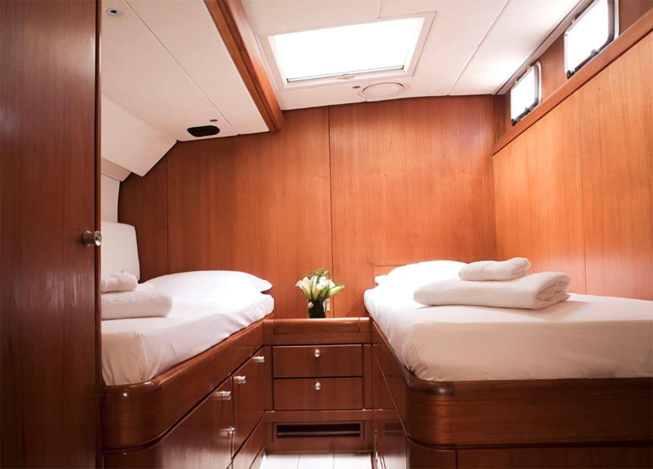 a room with two beds aboard ABEON Yacht for Charter