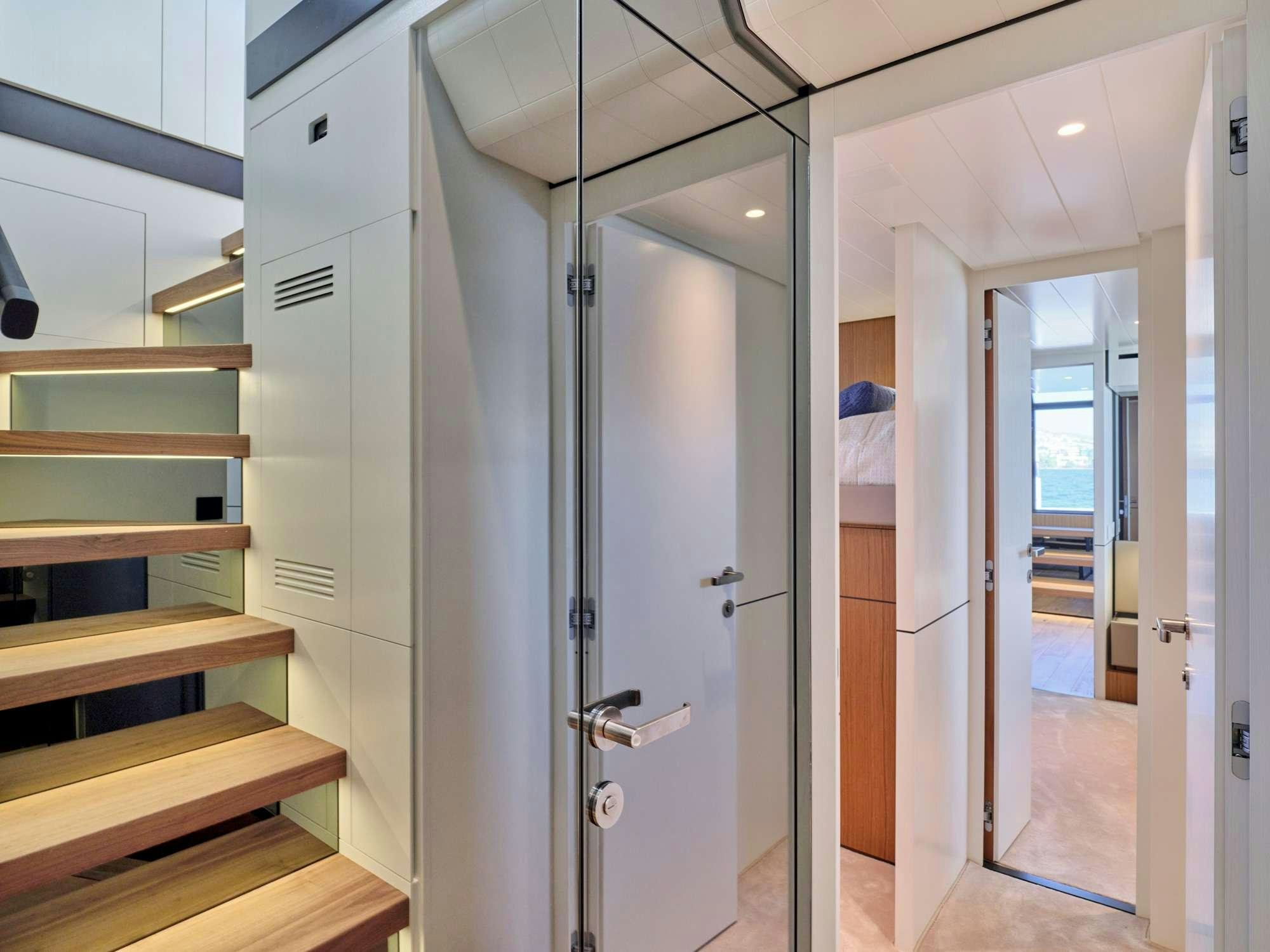a room with a closet and a staircase aboard DUCHESS Yacht for Charter