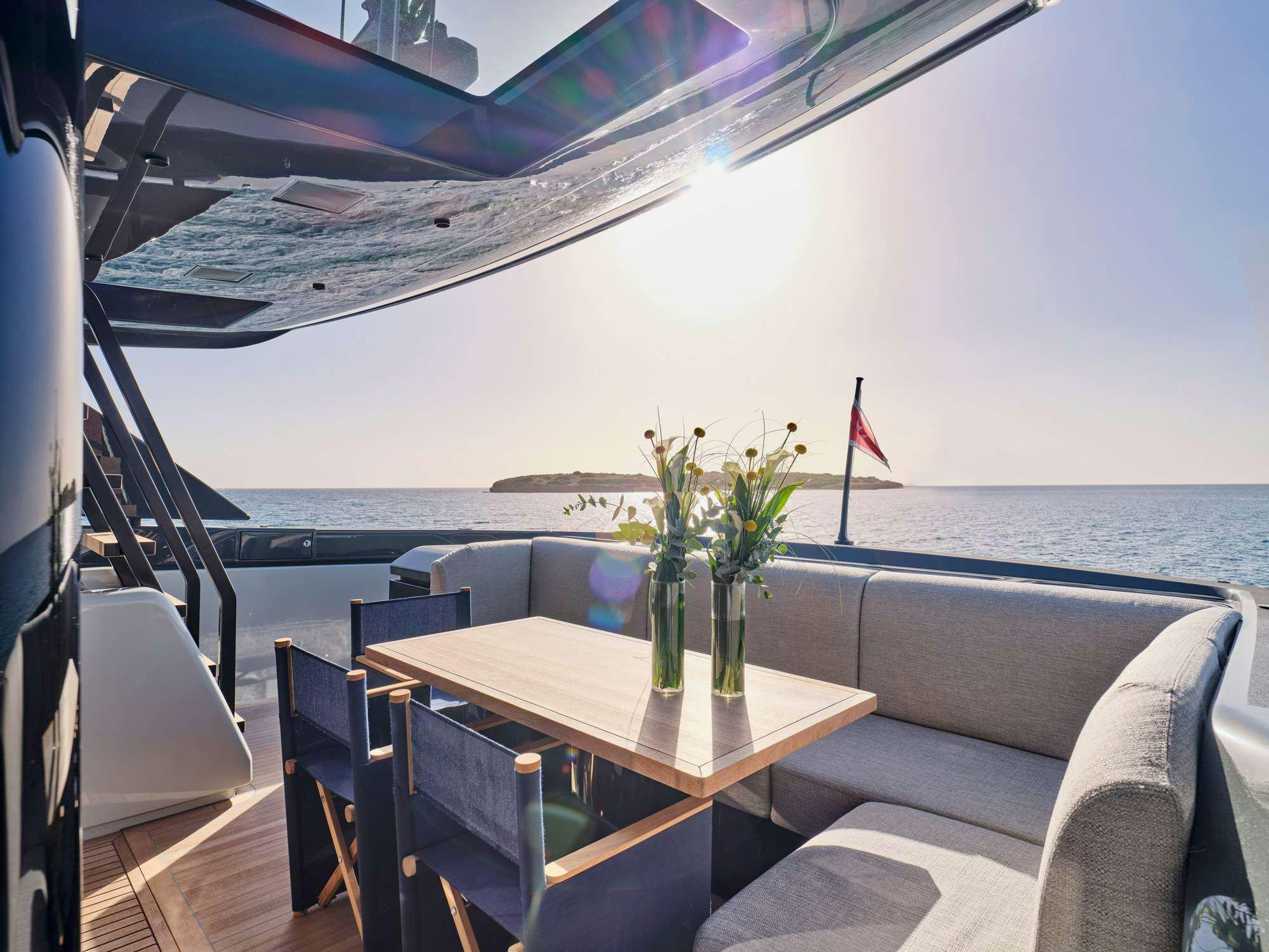 a table with flowers on it aboard DUCHESS Yacht for Charter