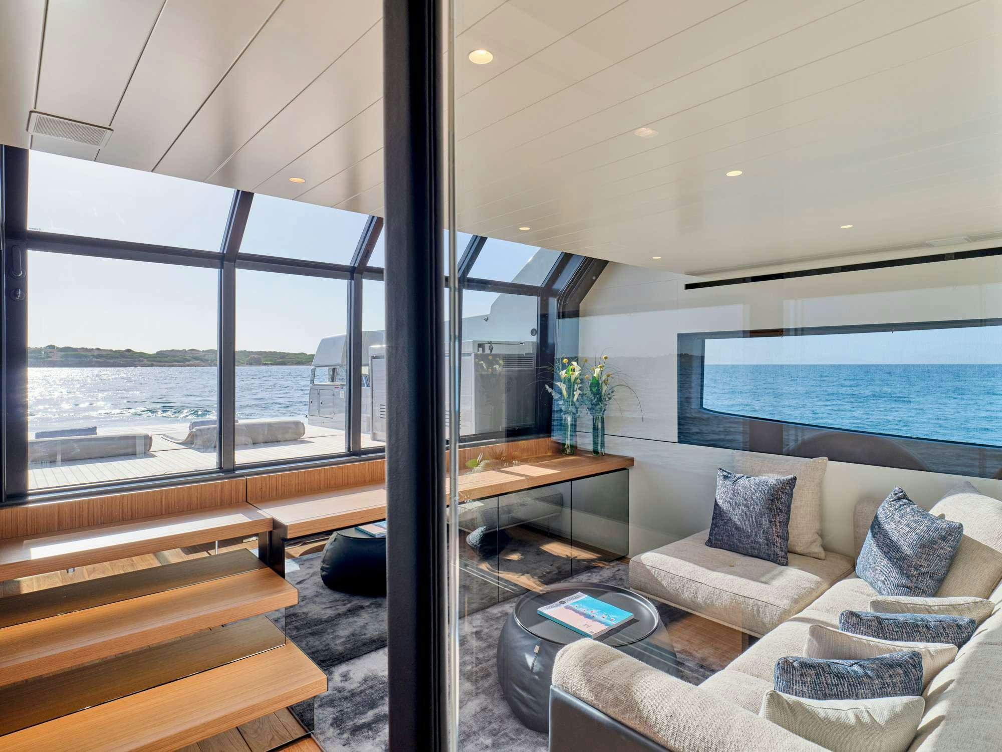 a room with a couch and a piano aboard DUCHESS Yacht for Charter