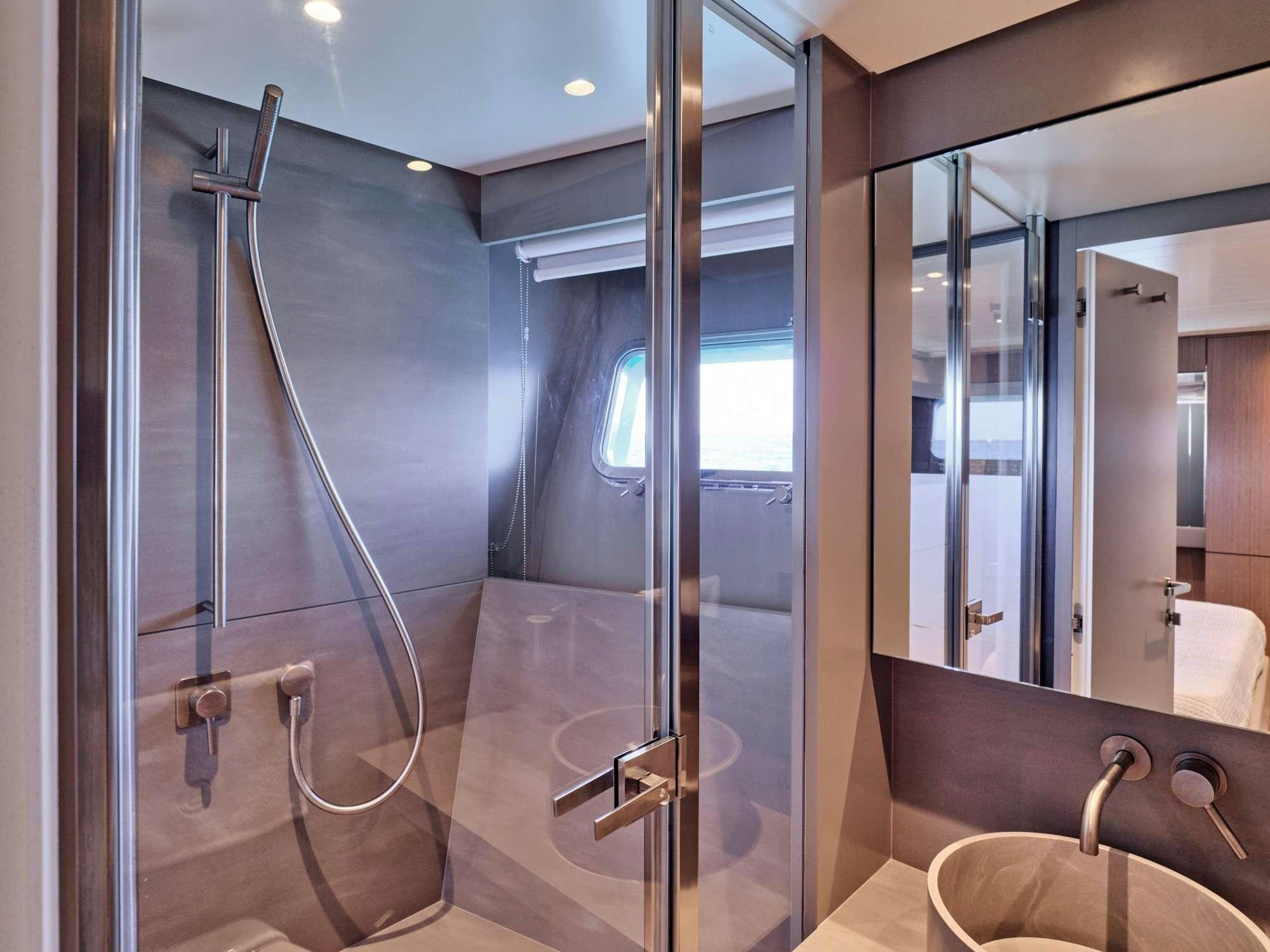 a bathroom with a shower unit aboard DUCHESS Yacht for Charter