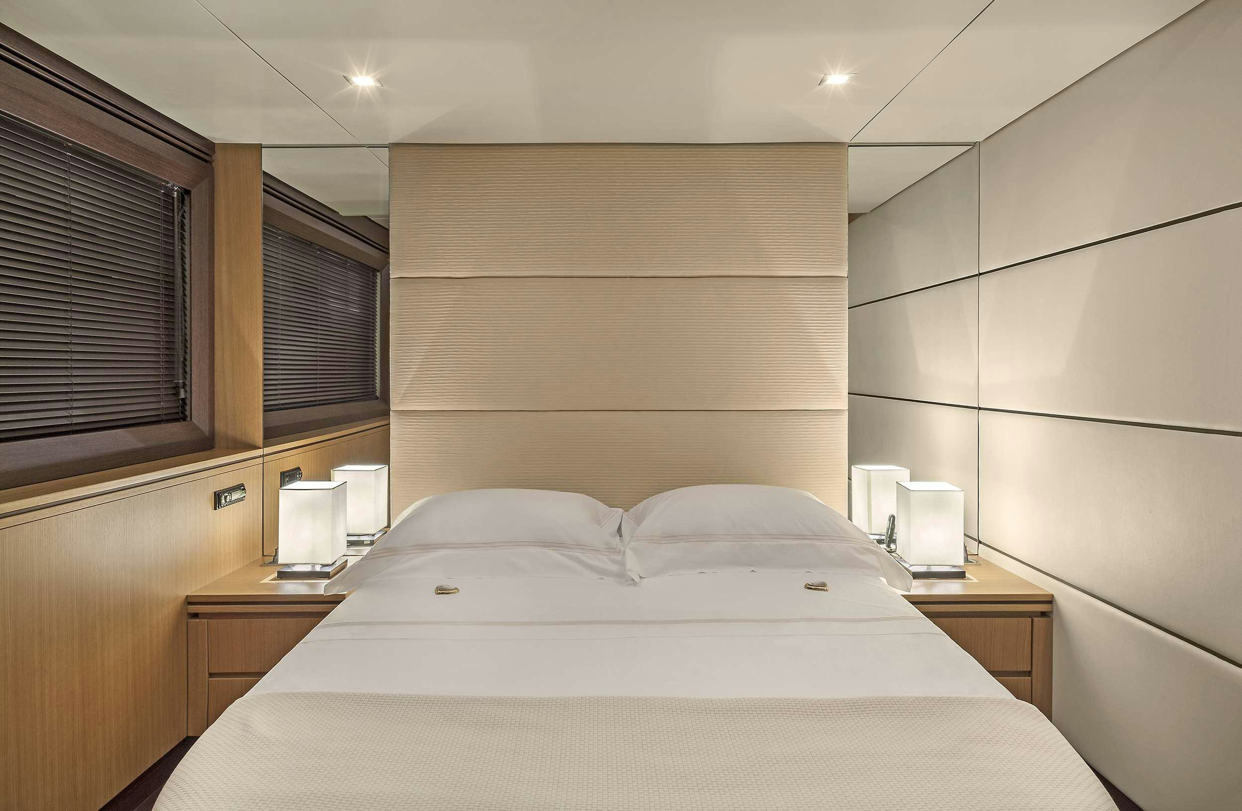 a hotel room with a bed aboard DUNE Yacht for Charter