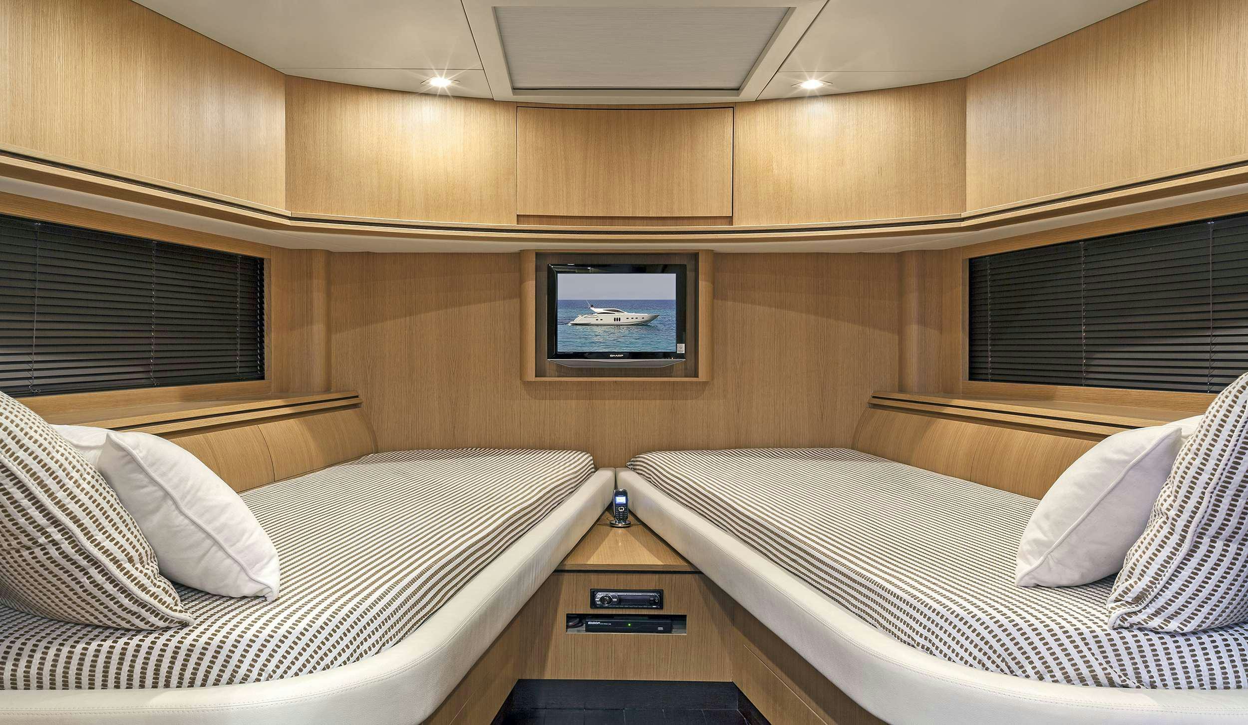 a room with two beds aboard DUNE Yacht for Charter