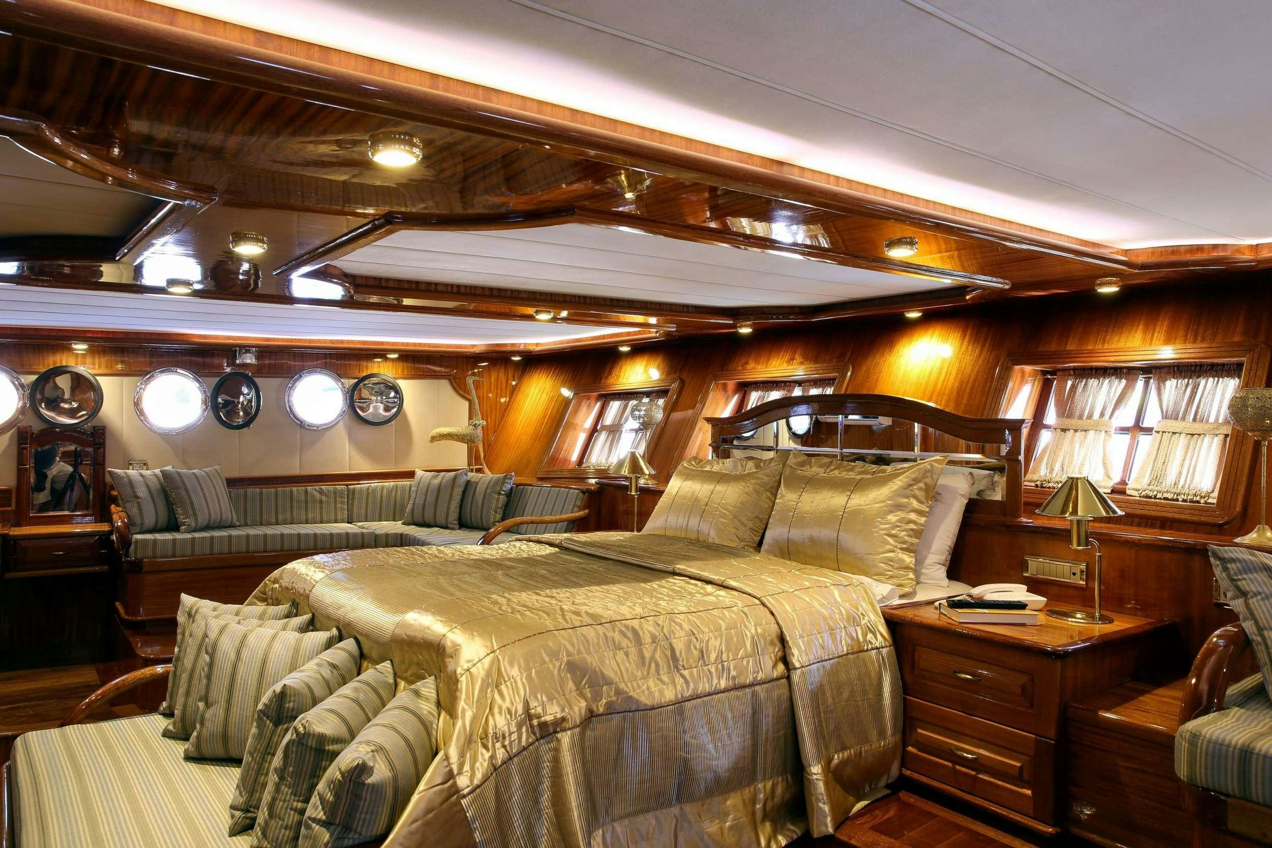 a large bedroom with a large bed aboard QUEEN ATLANTIS Yacht for Charter