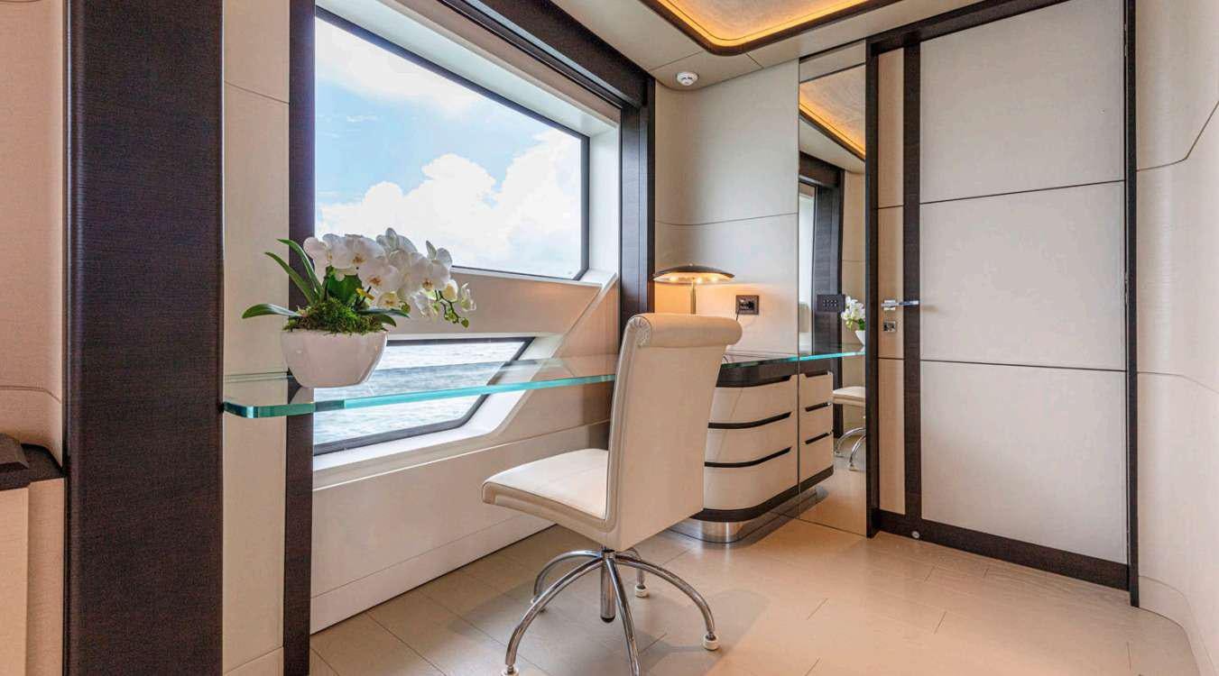 a room with a table and chairs aboard VAYUS Yacht for Charter