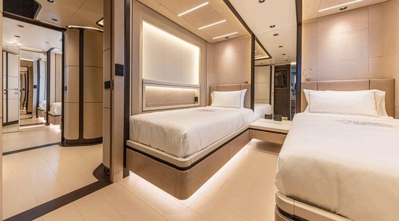 a room with two beds aboard VAYUS Yacht for Charter