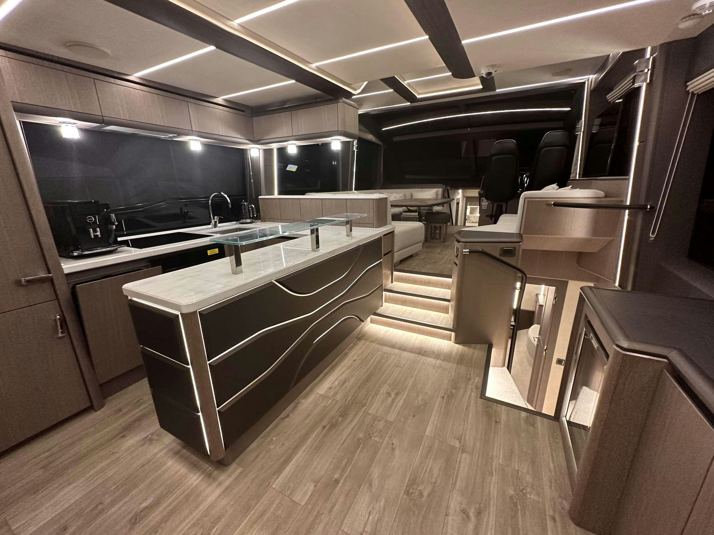 a kitchen with a large island aboard PARADISE Yacht for Charter
