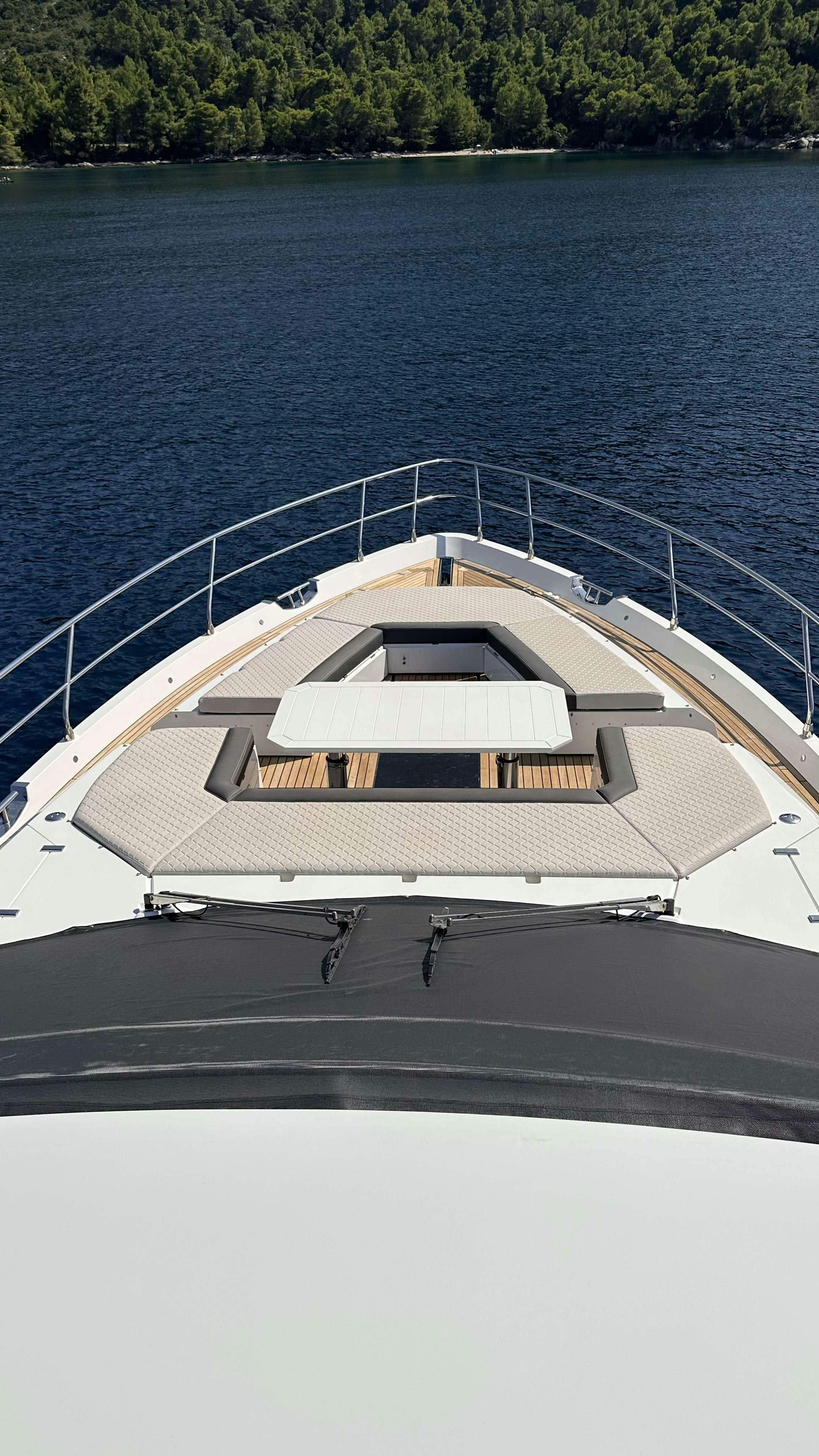 a large white building by a body of water aboard PARADISE Yacht for Charter