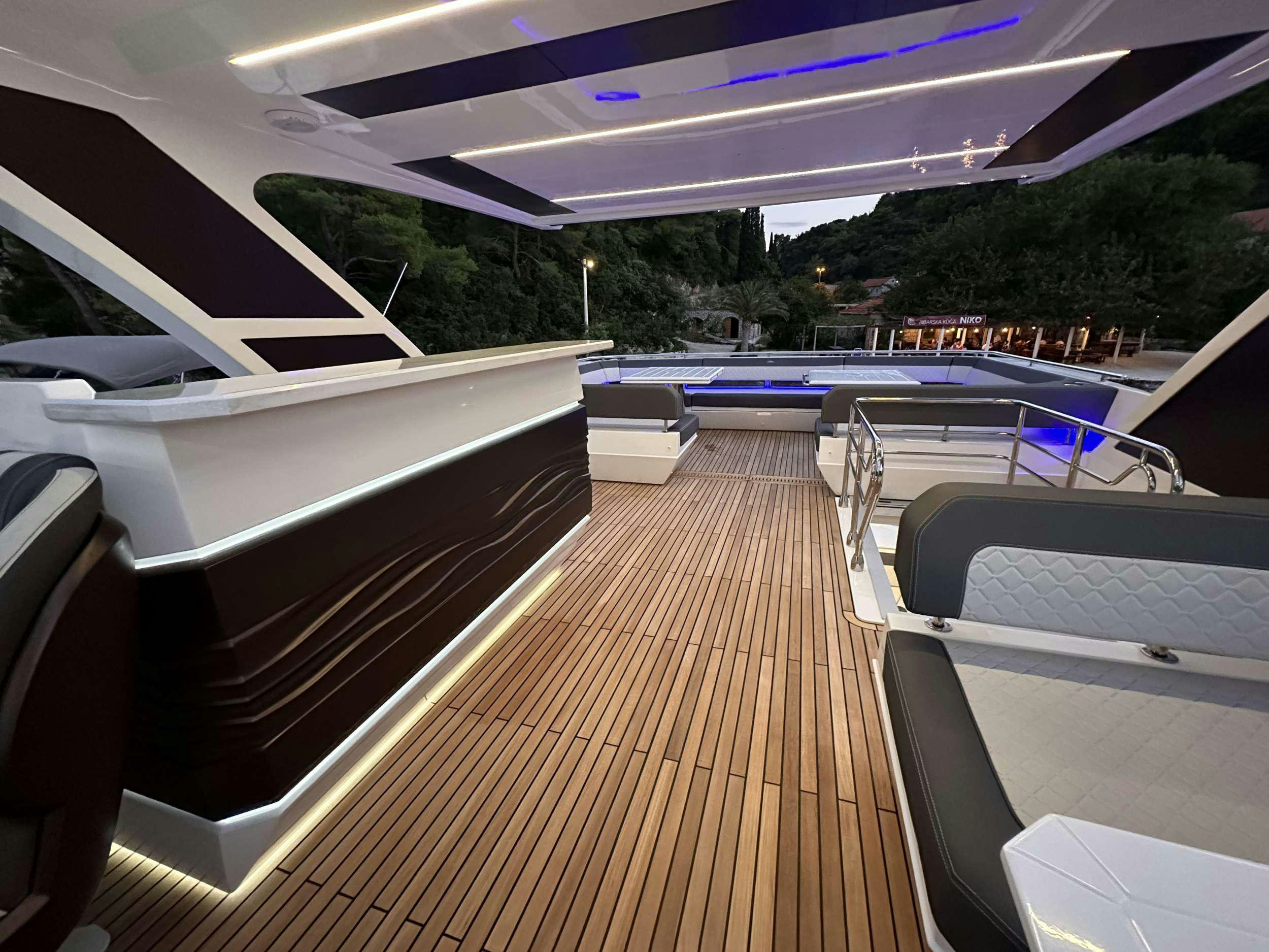 a deck with a deck and pool aboard PARADISE Yacht for Charter