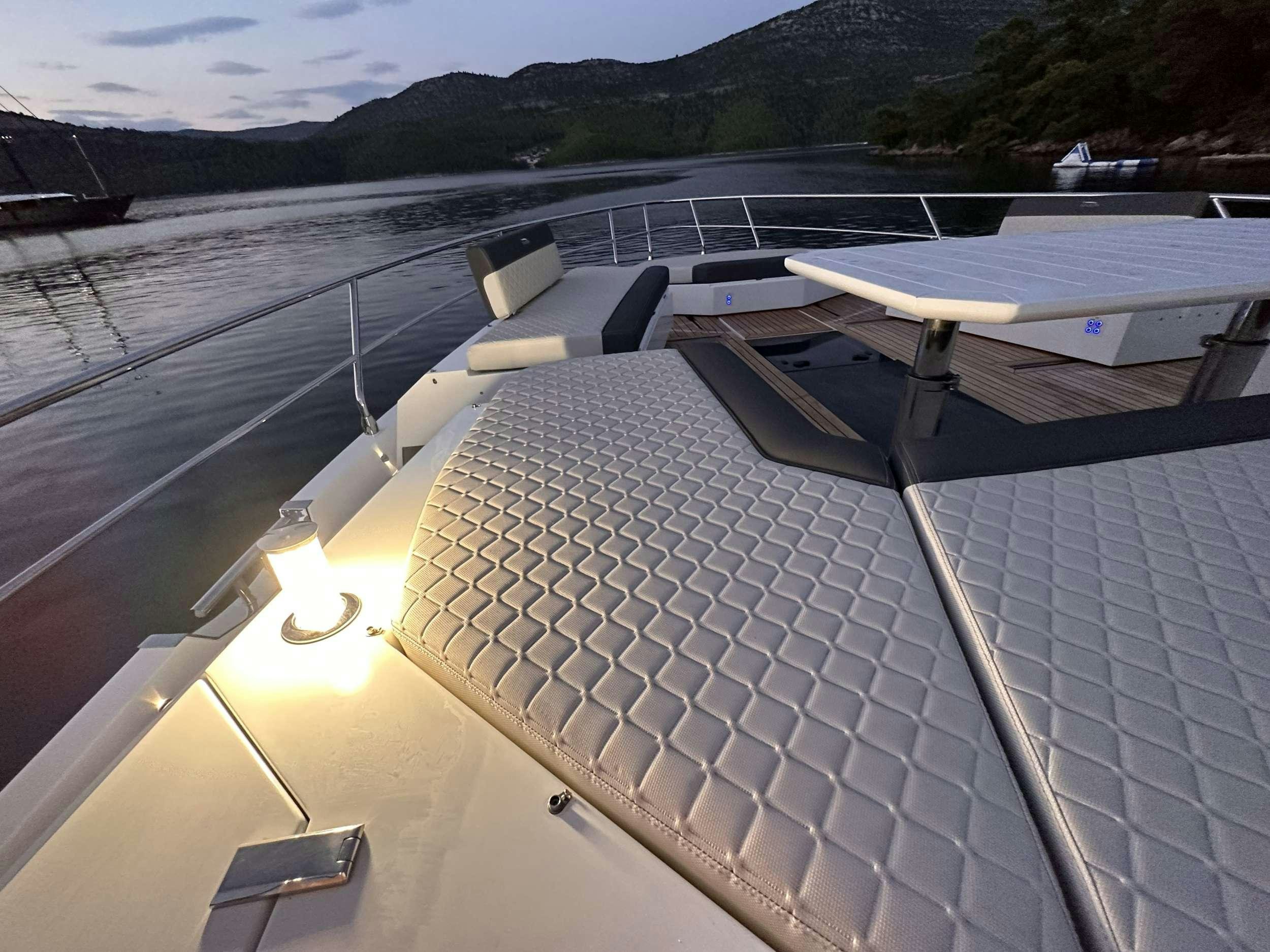 a deck with a deck and a pool of water aboard PARADISE Yacht for Charter