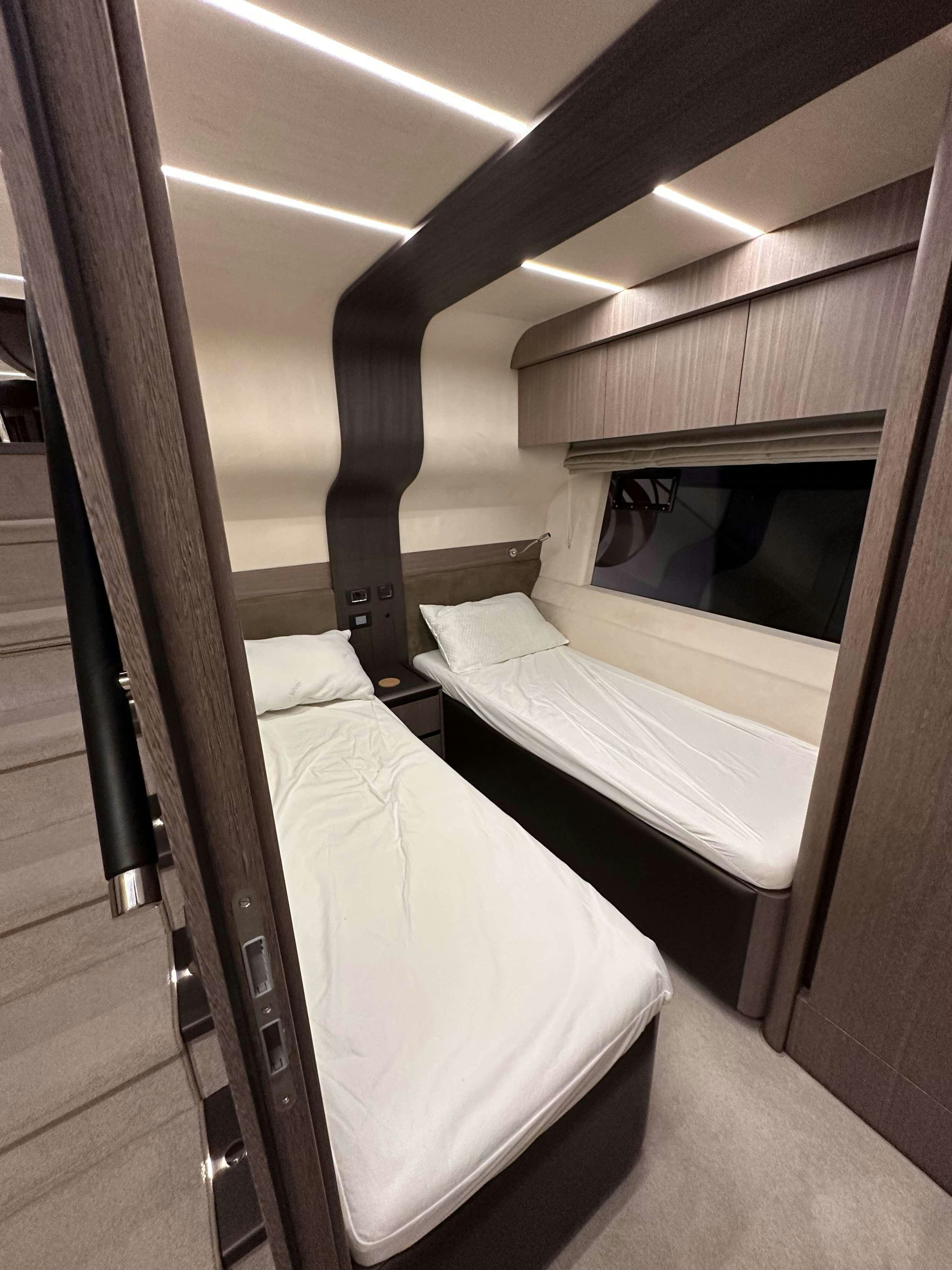 a room with two beds aboard PARADISE Yacht for Charter