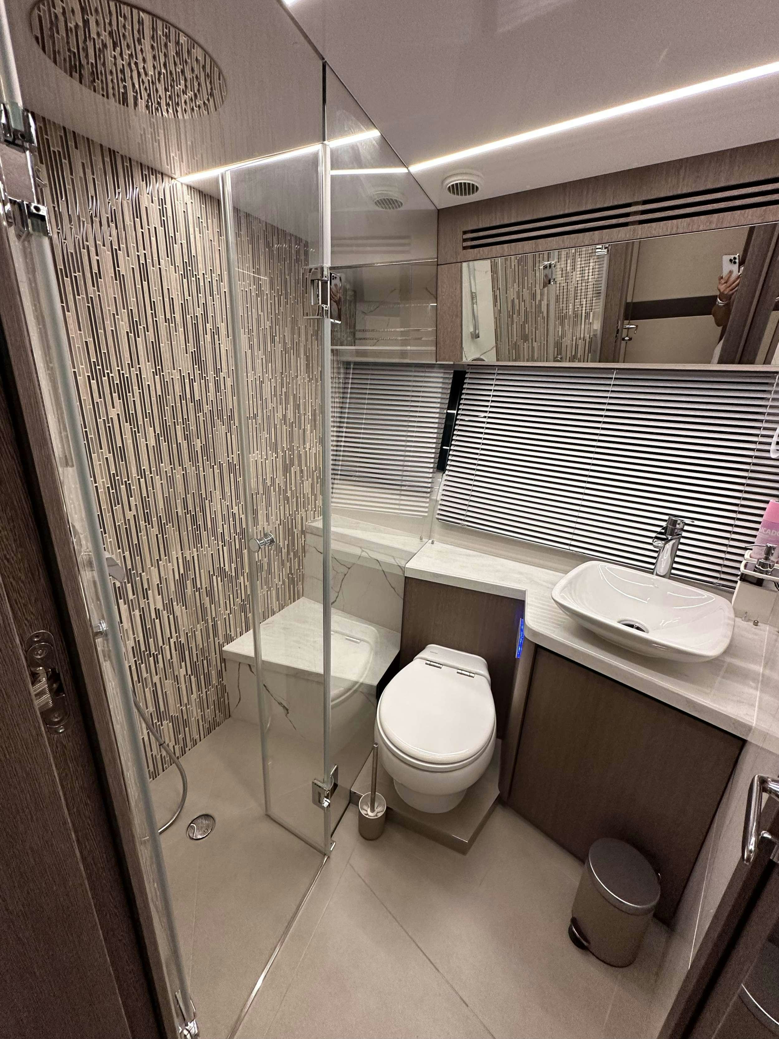 a bathroom with a shower and toilet aboard PARADISE Yacht for Charter