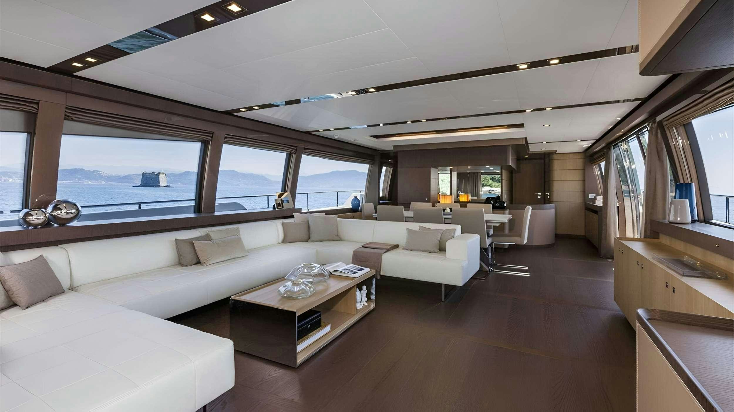 a living room with a large window aboard IVA Yacht for Charter
