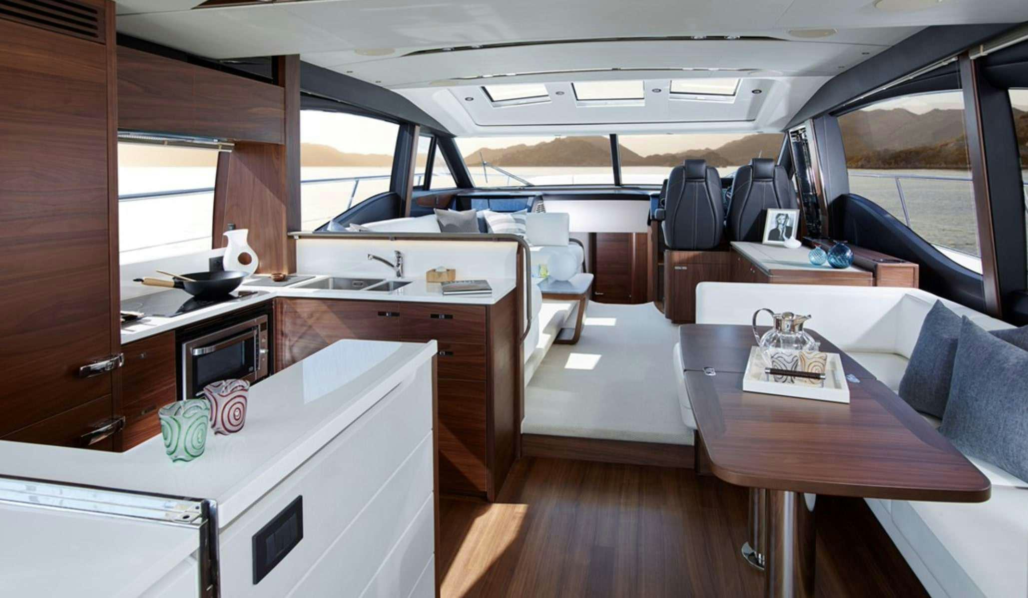 a cabin with a table and chairs aboard FAR & AWAY Yacht for Charter