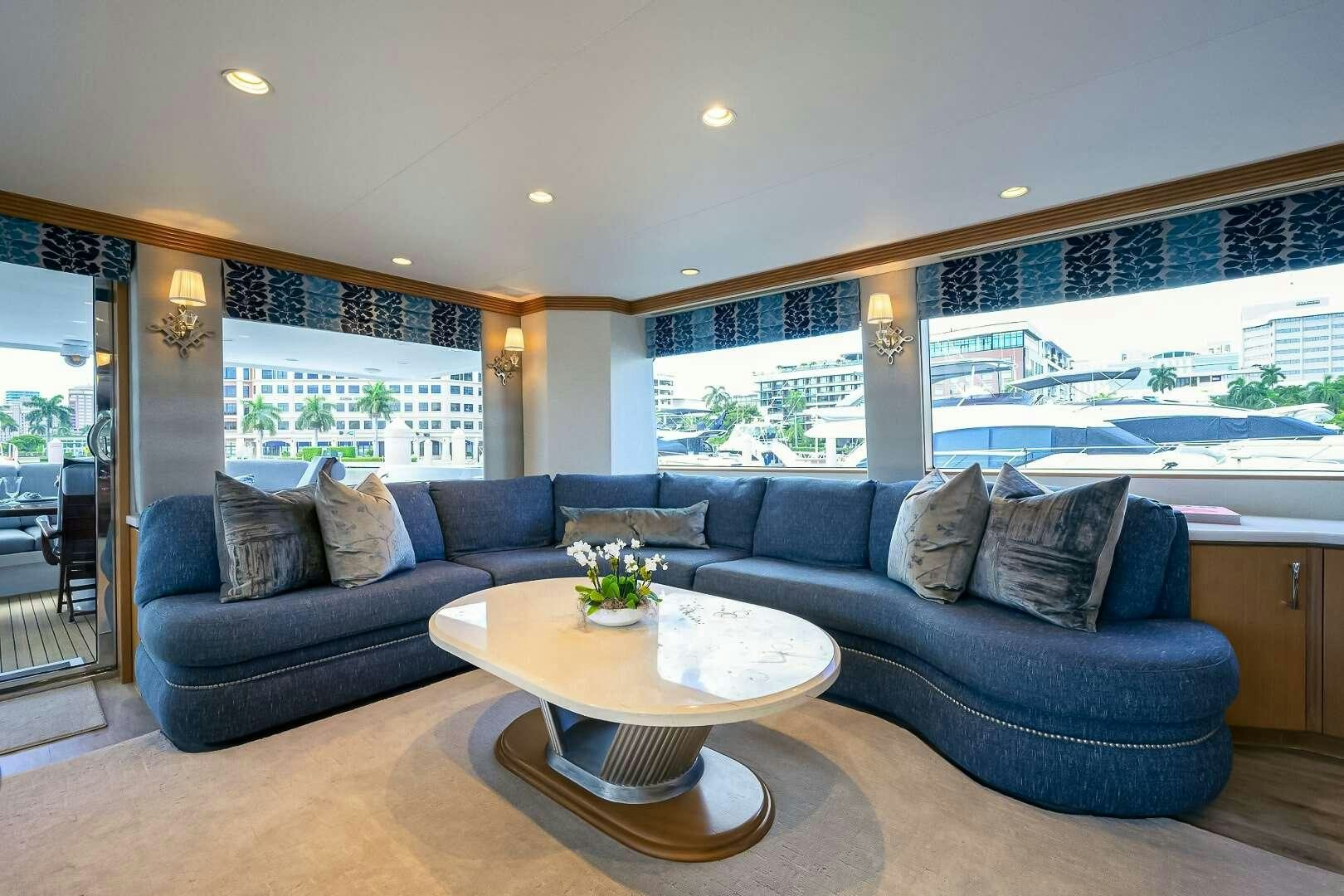 a living room with a large window aboard HARD TIMES Yacht for Charter