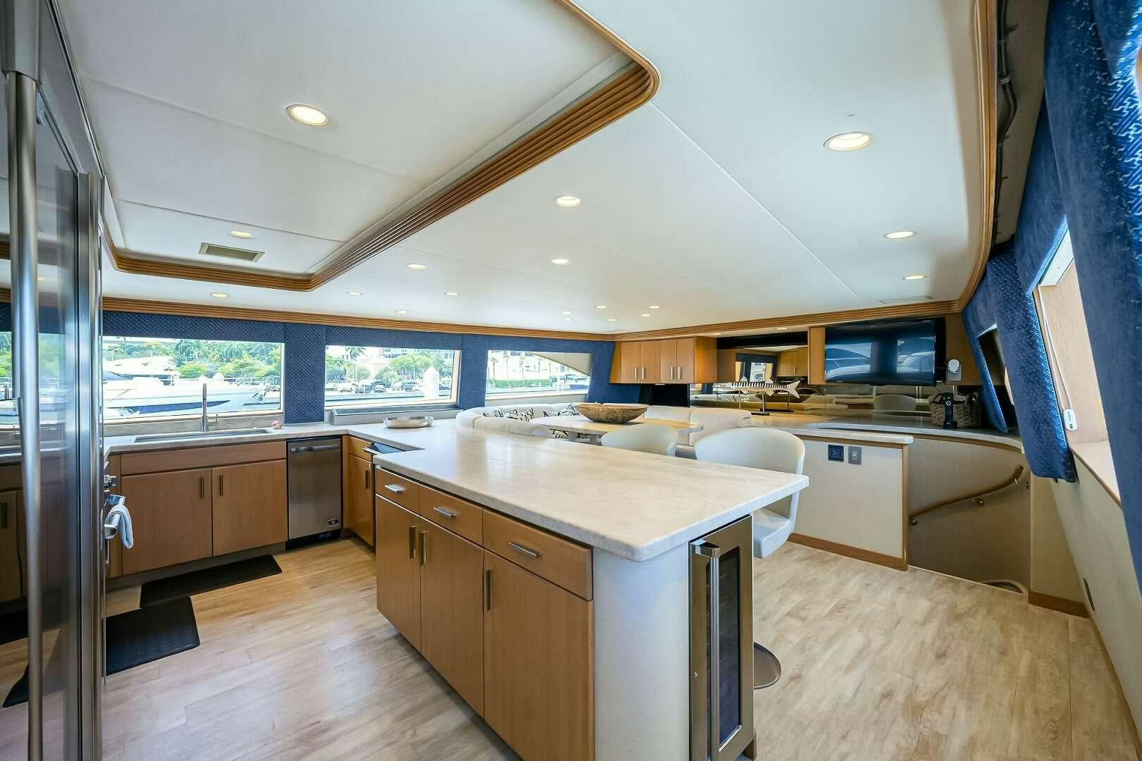 a kitchen with a large island aboard HARD TIMES Yacht for Charter