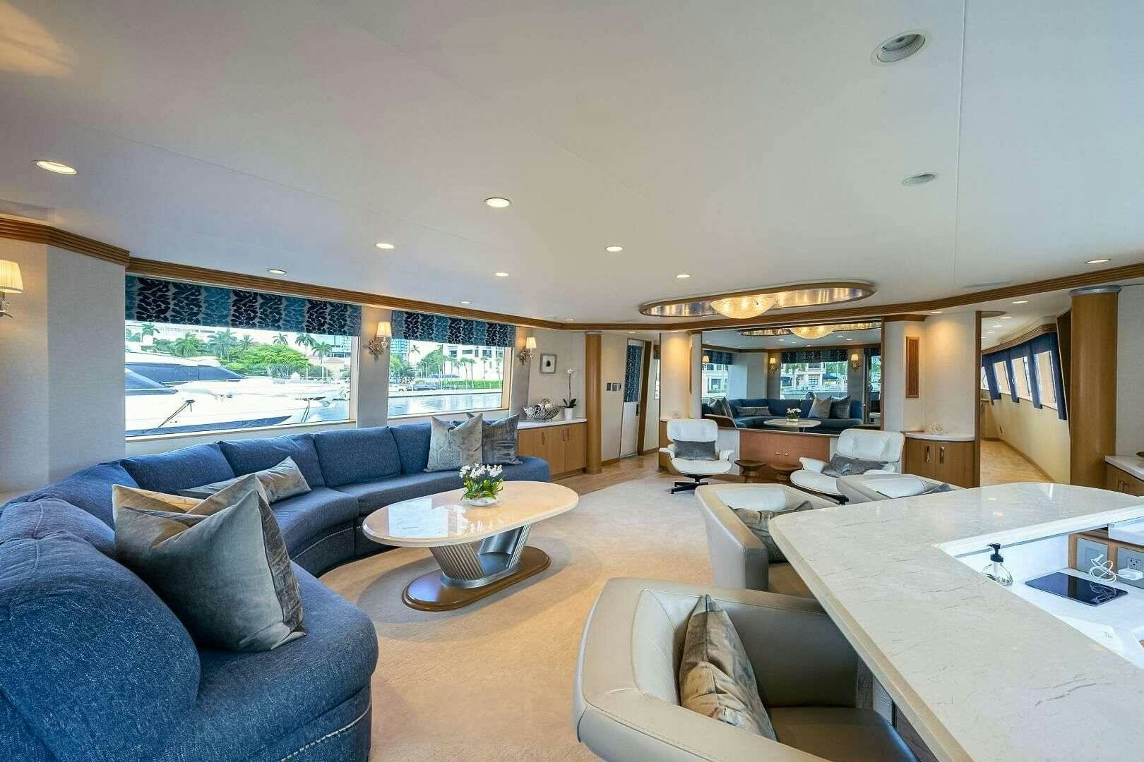 a living room with a large window aboard HARD TIMES Yacht for Charter