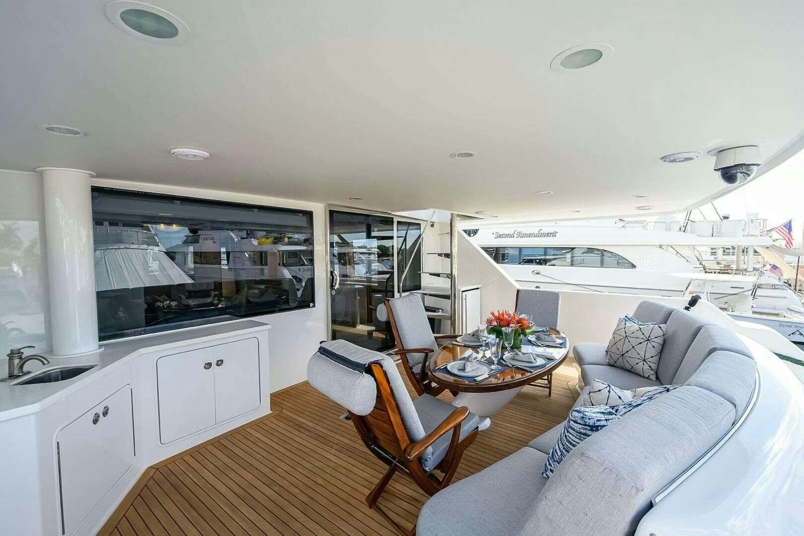 a living room with a couch and a table aboard HARD TIMES Yacht for Charter