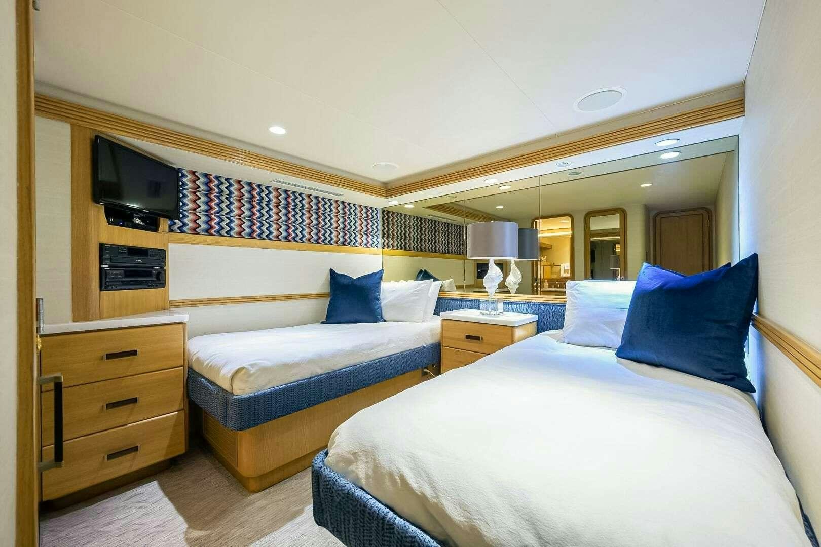 a couple of beds in a hotel room aboard HARD TIMES Yacht for Charter