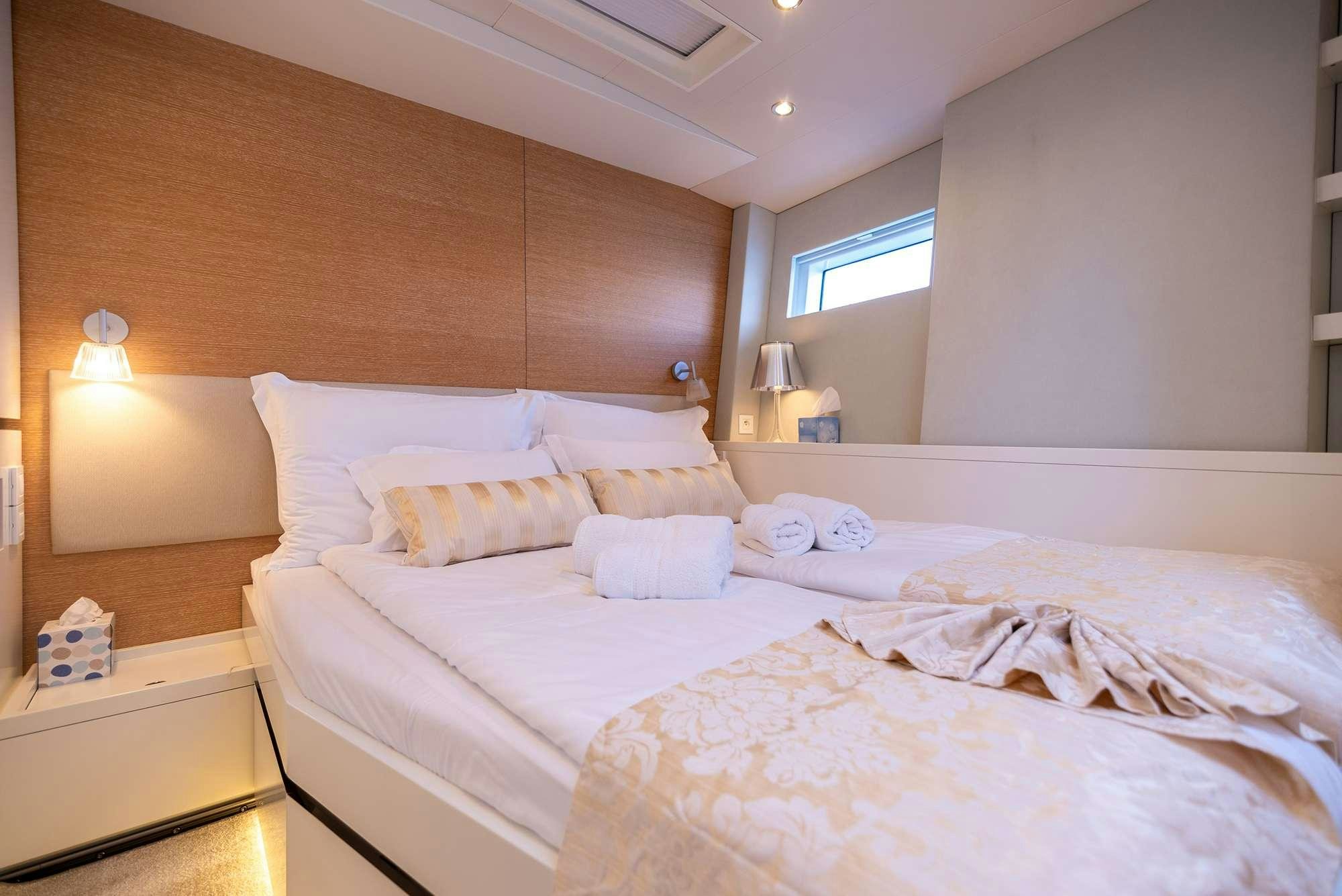 a room with two beds aboard BUBBLES Yacht for Charter