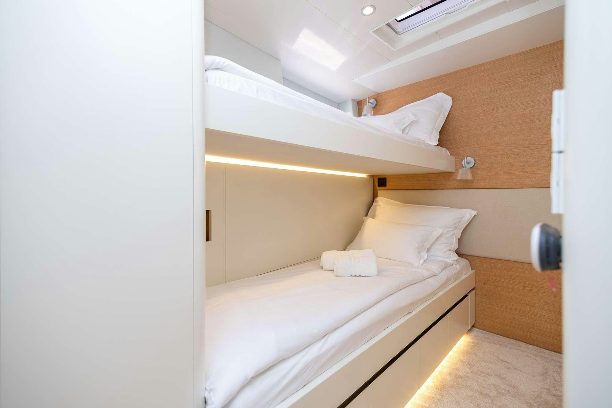 a room with two beds aboard BUBBLES Yacht for Charter