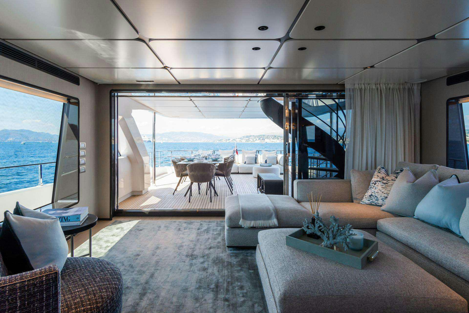 a living room with a large window aboard MRS L Yacht for Charter