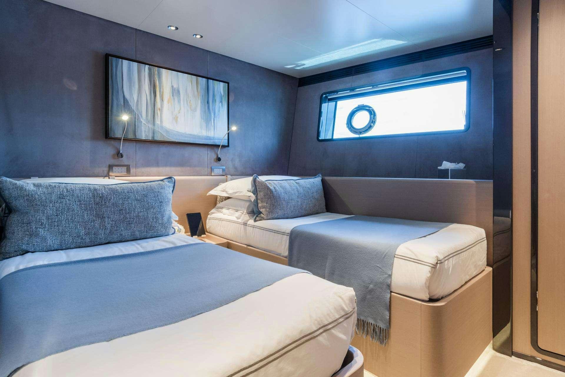 a room with a bed and a couch aboard MRS L Yacht for Charter