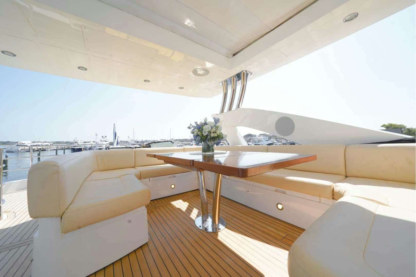 a room with a table and couches aboard CATCH THE WAVE Yacht for Charter