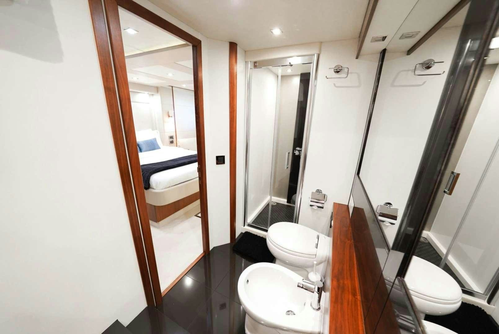 a bathroom with a toilet and a sink aboard CATCH THE WAVE Yacht for Charter