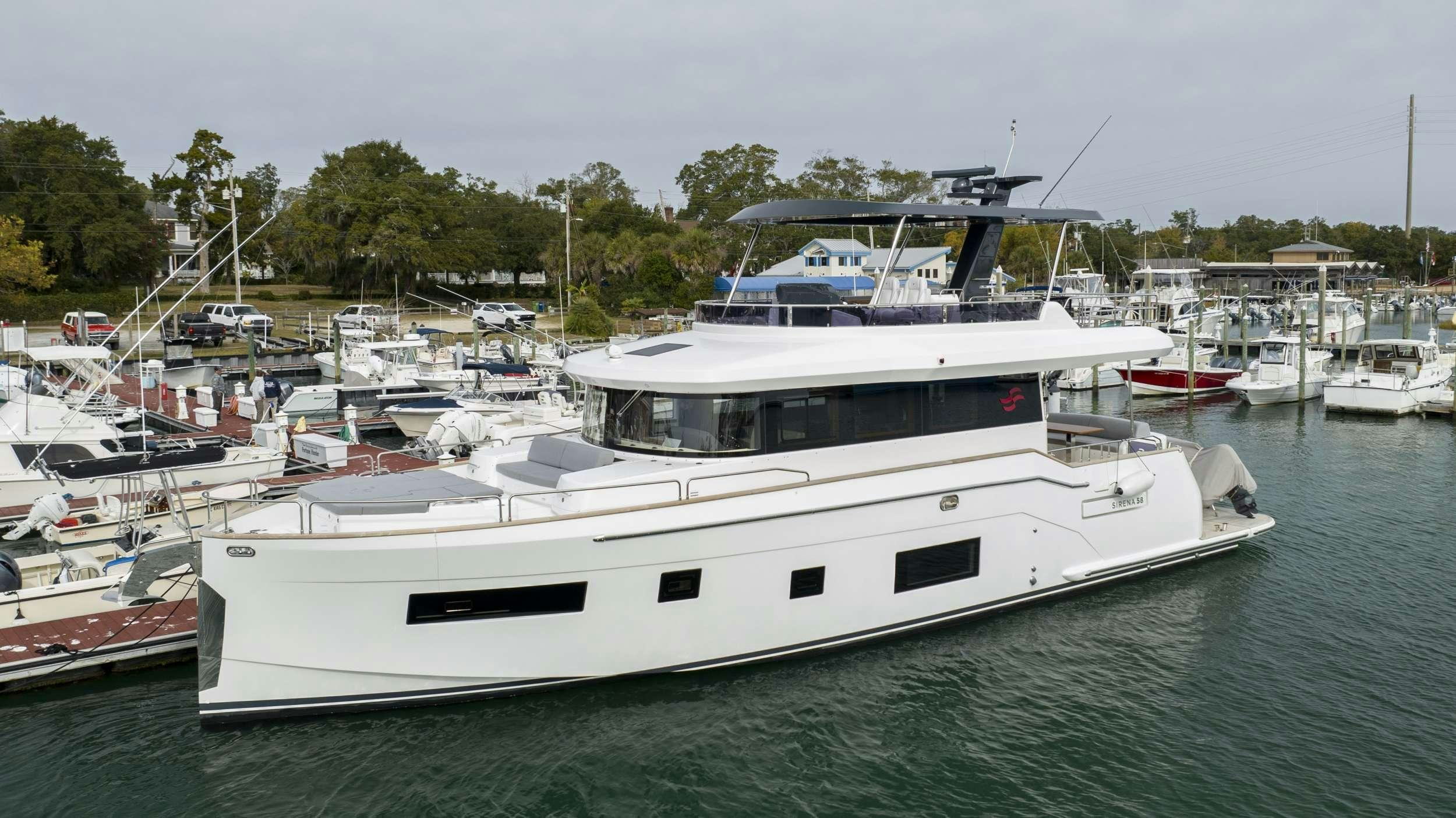 a boat in a harbor aboard OBRIGADA Yacht for Charter
