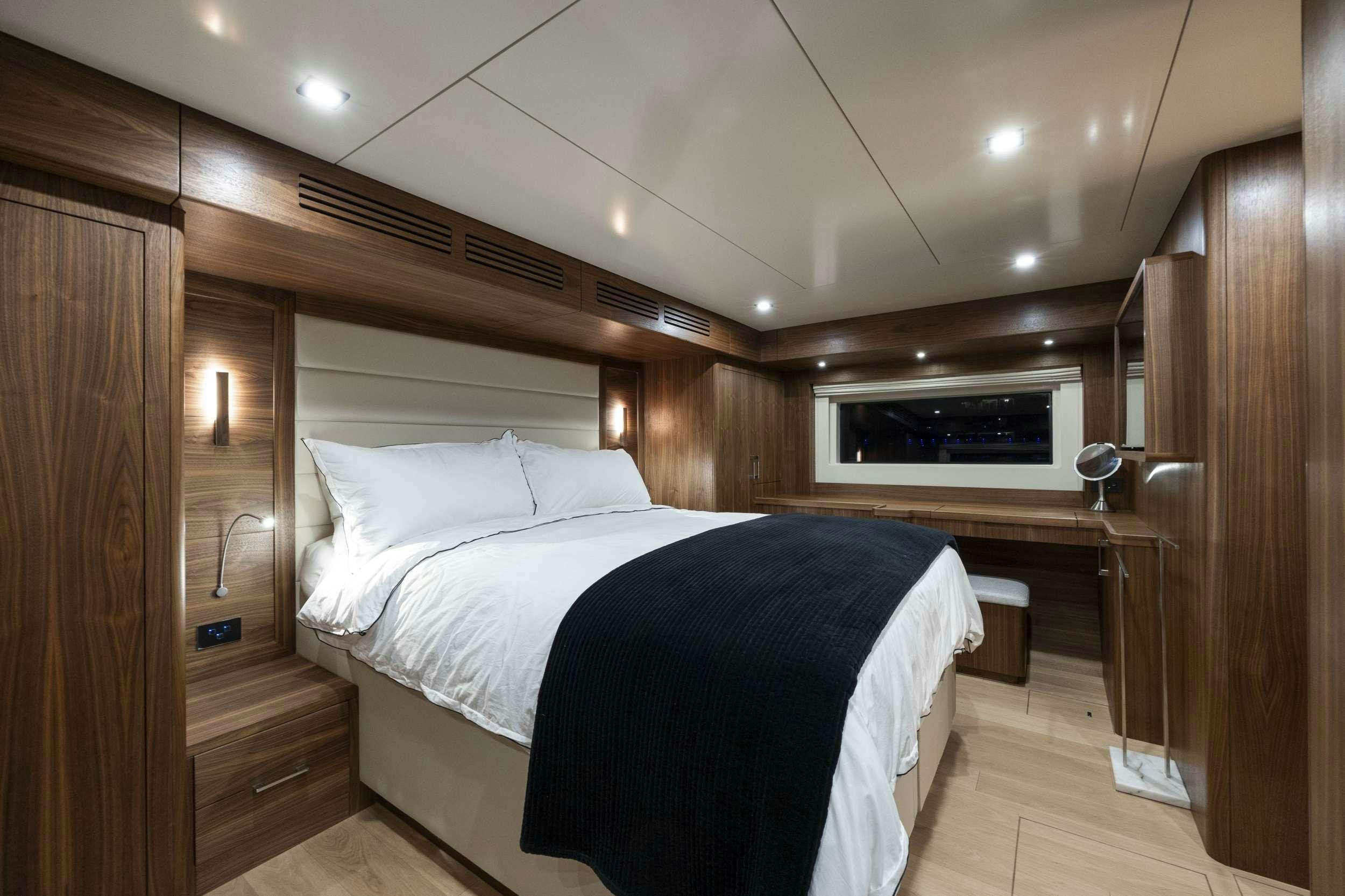 a bed in a room aboard OBRIGADA Yacht for Charter