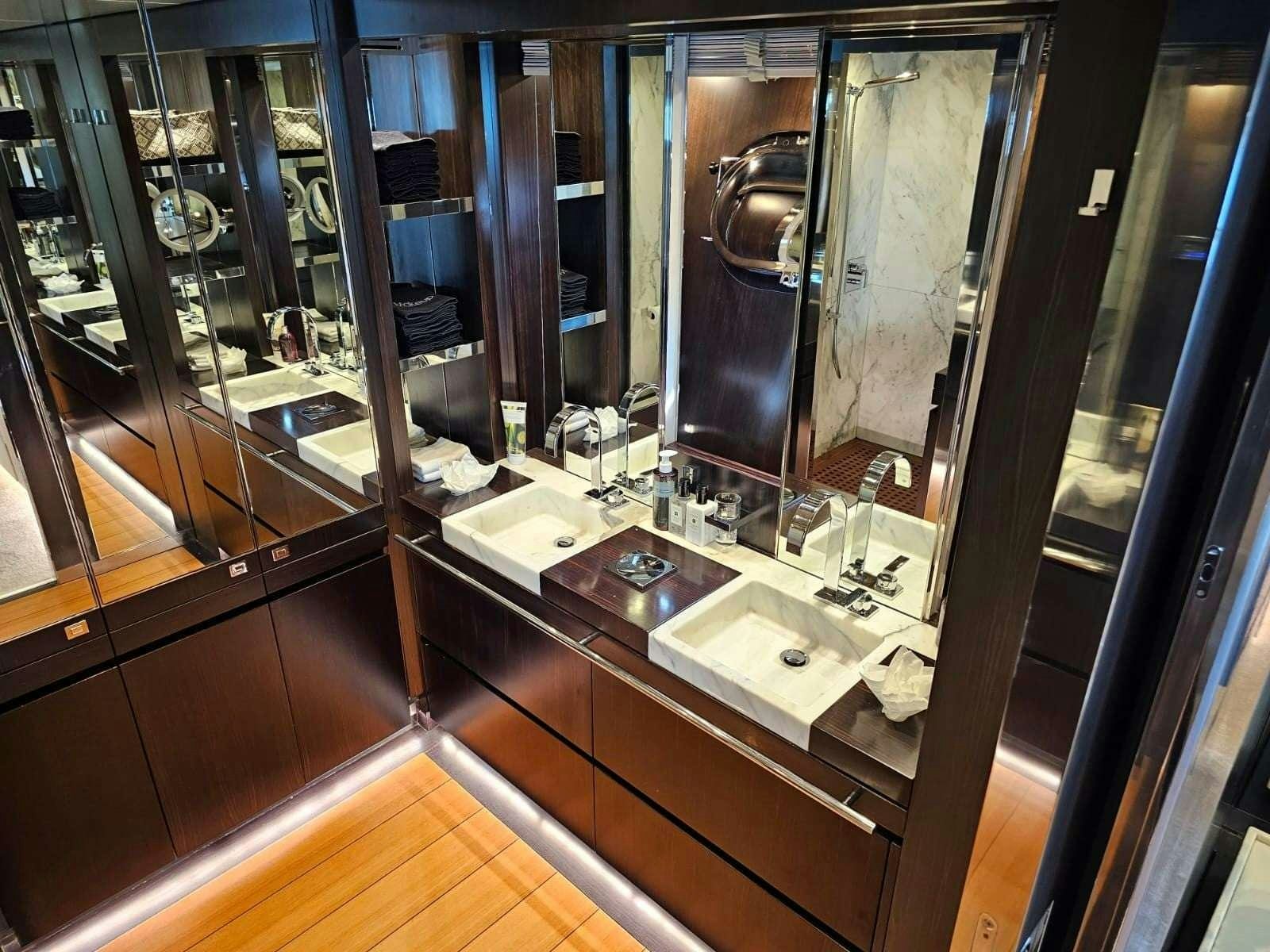a bathroom with a large mirror aboard MAC Yacht for Charter