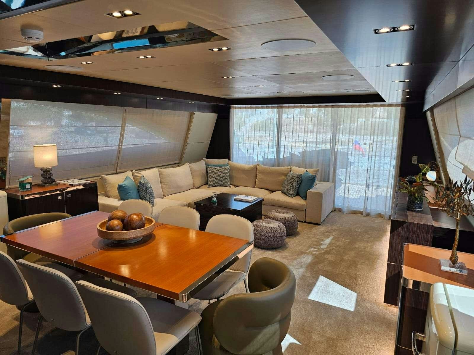 a living room with a couch and a table aboard MAC Yacht for Charter