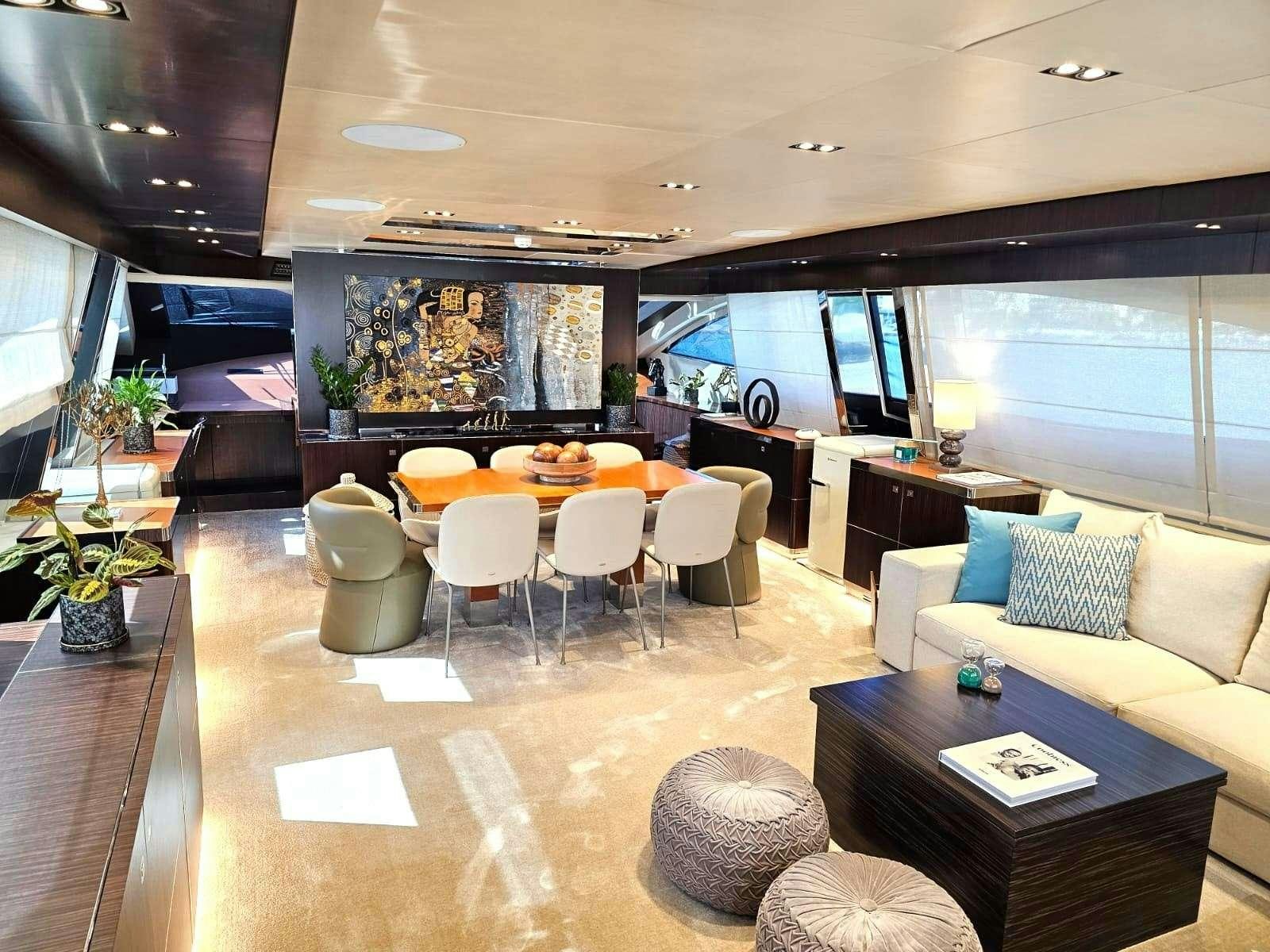 a living room with a couch and a table aboard MAC Yacht for Charter