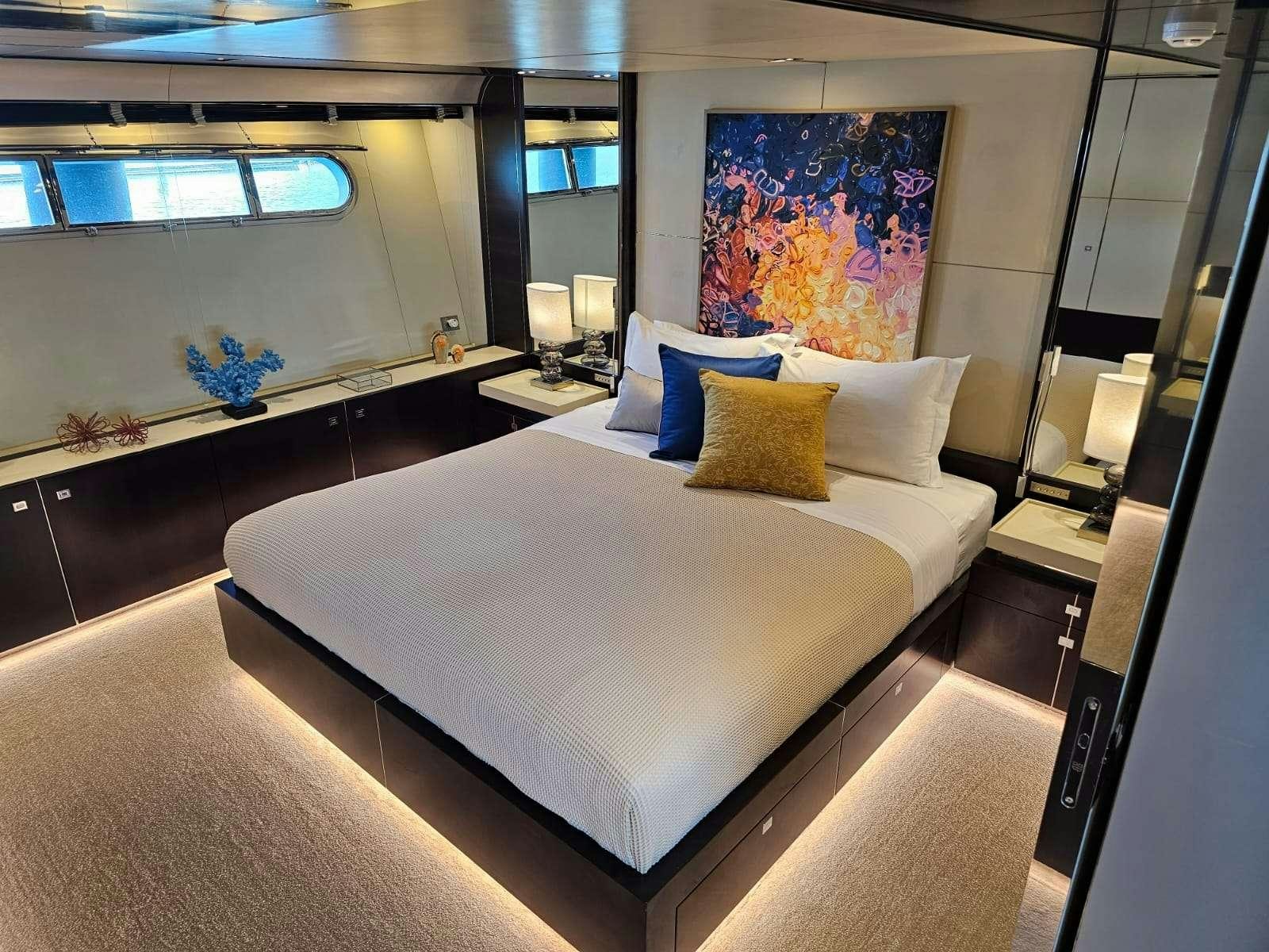a bed in a room aboard MAC Yacht for Charter