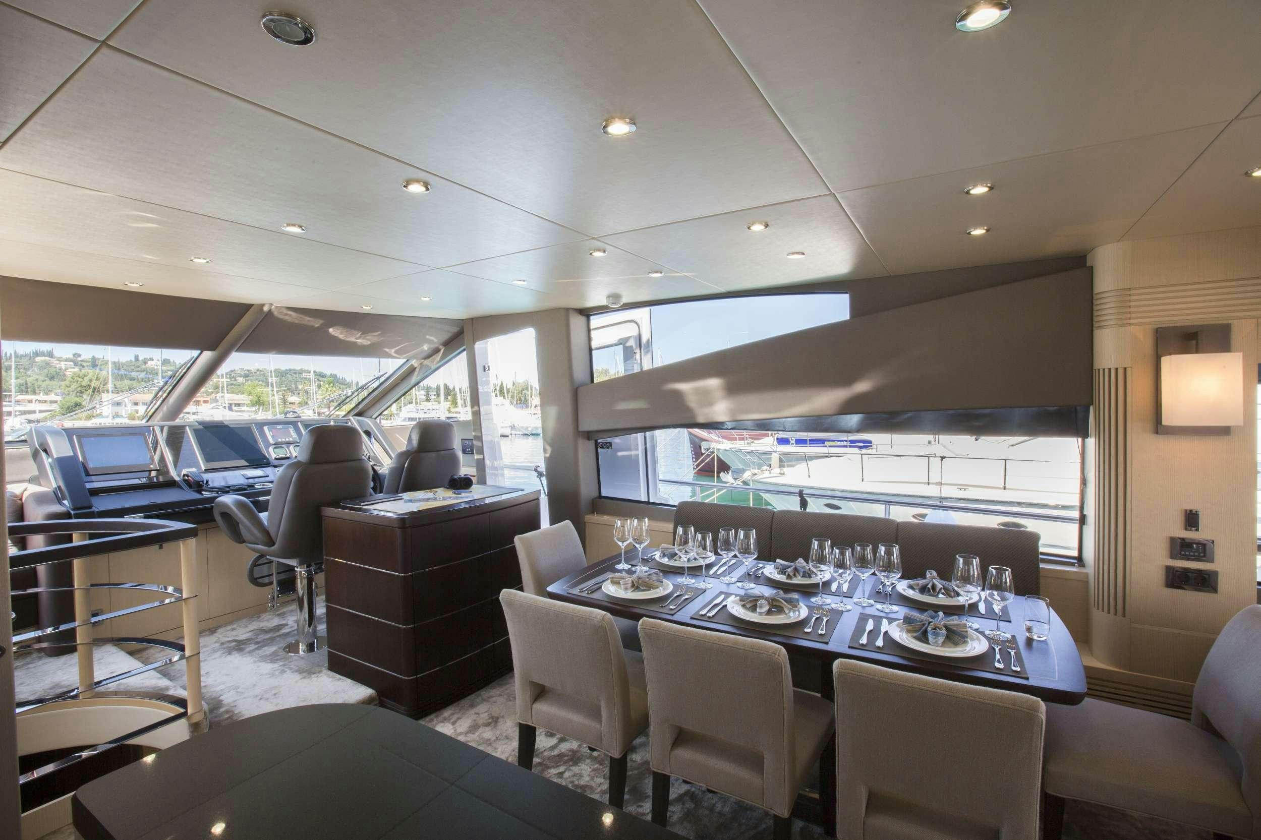 a large room with a table and chairs aboard FINEZZA Yacht for Charter