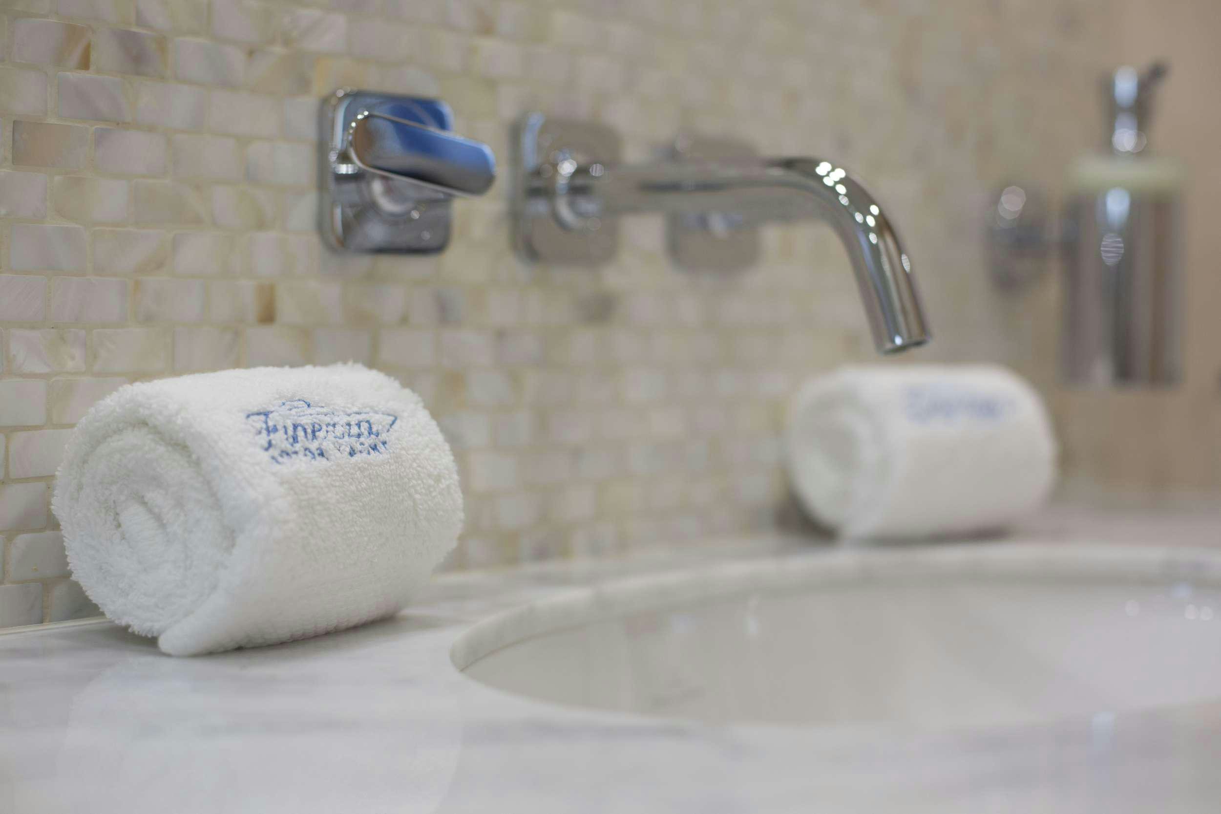 a bathroom sink with a soap dispenser and a soap dispenser aboard FINEZZA Yacht for Charter